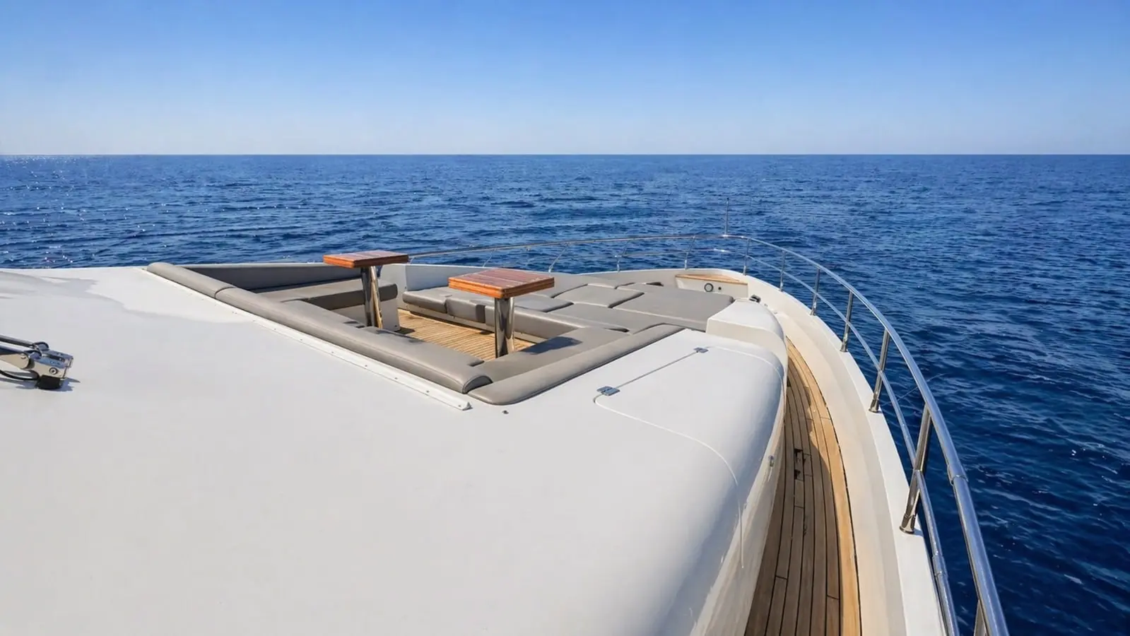 Azimut 88 foredeck sunpad lounge with two teak top tables