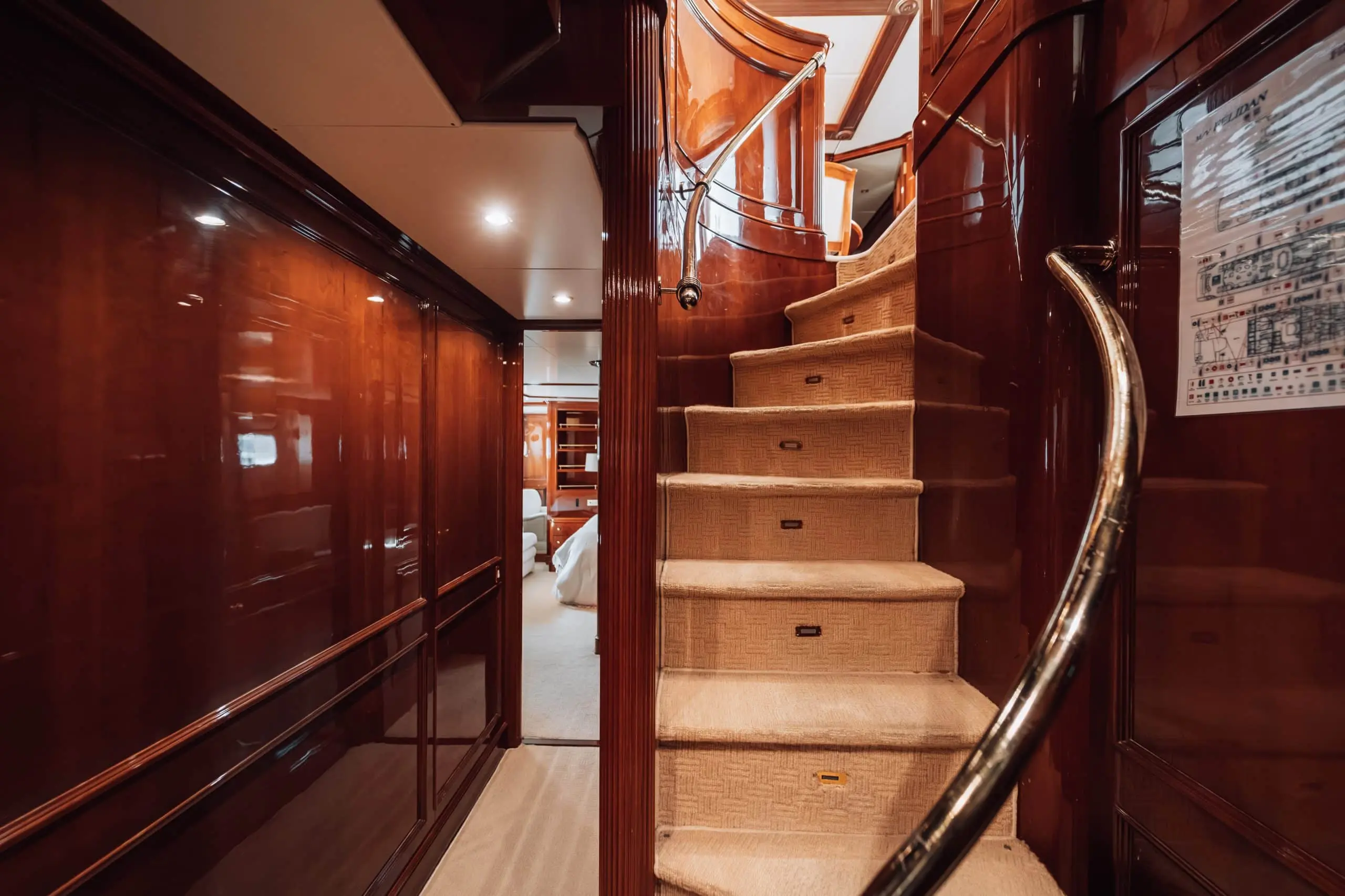 Wooden spiral staircase inside Royal Mirage luxury yacht