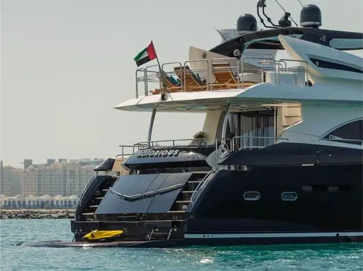 Stern view of Notorious yacht with swim platform and UAE flag