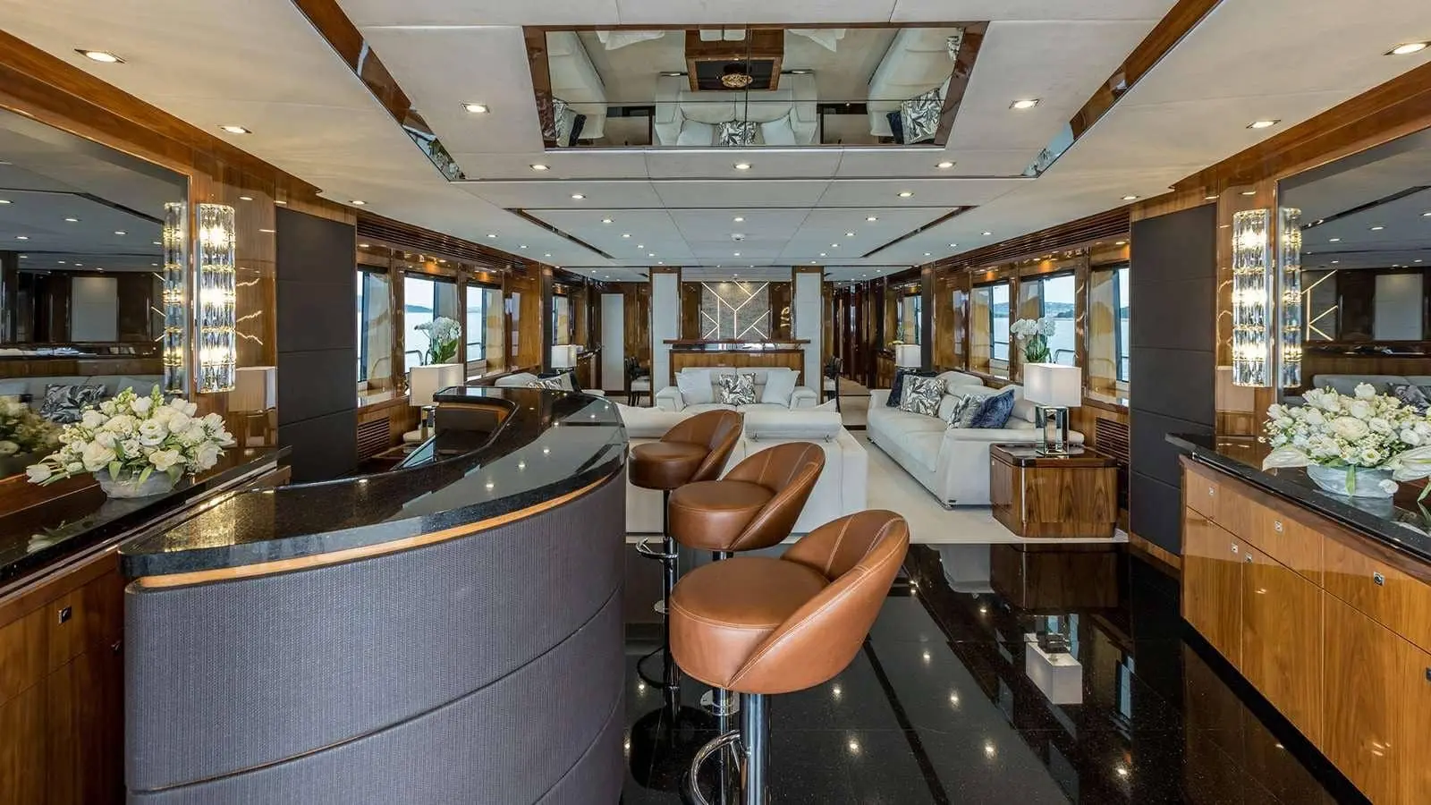 Sunseeker 37M main saloon bar with leather stools, walnut joinery