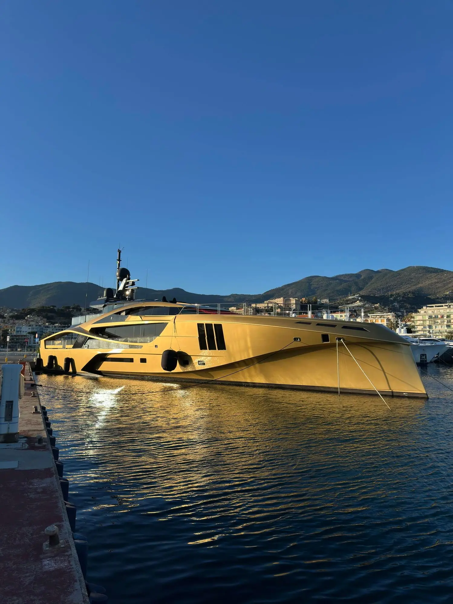 SuperSport 48 dockside profile showing her gold hull lines