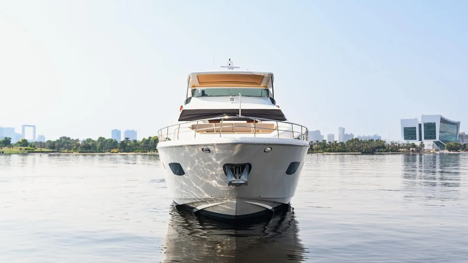 Azimut 88 bow view at anchor against the Dubai city skyline