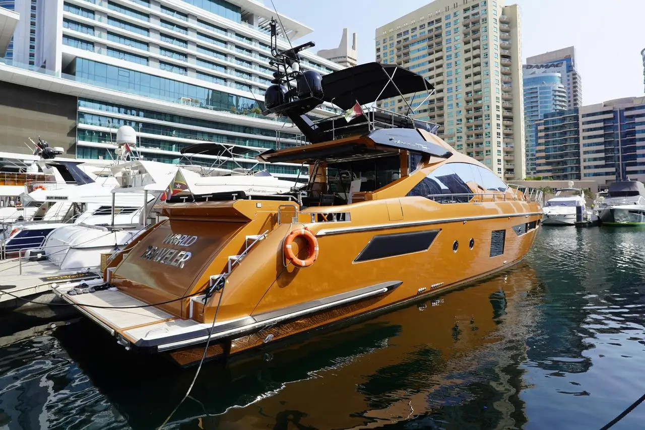 Azimut 77 yacht docked in Dubai Marina with luxury buildings in the background
