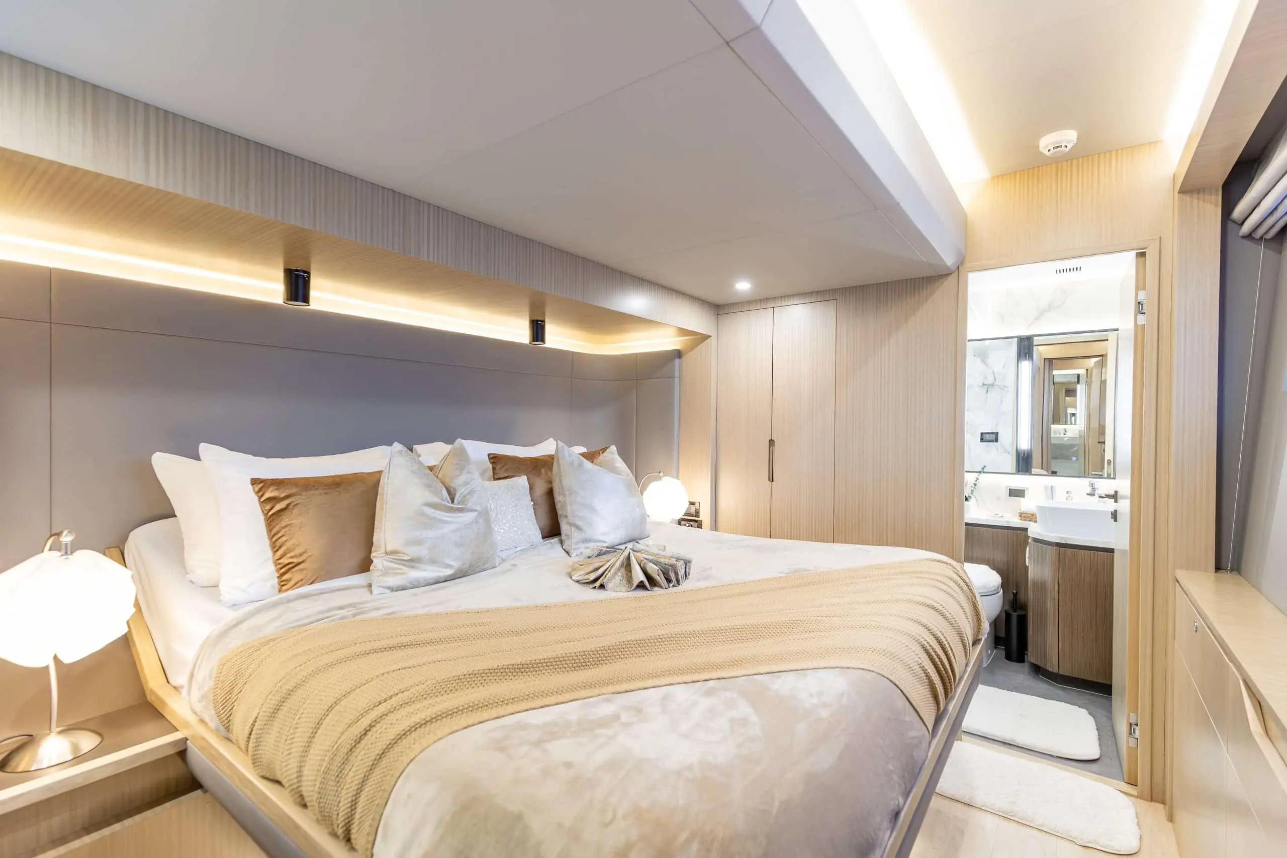 Luxury master bedroom interior of Zirve 72 motor yacht with modern wood paneling
