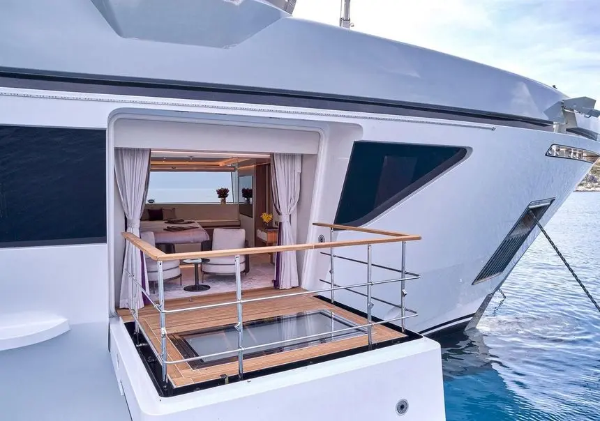 Sanlorenzo 500EXP fold-down balcony terrace over the water, broker photo