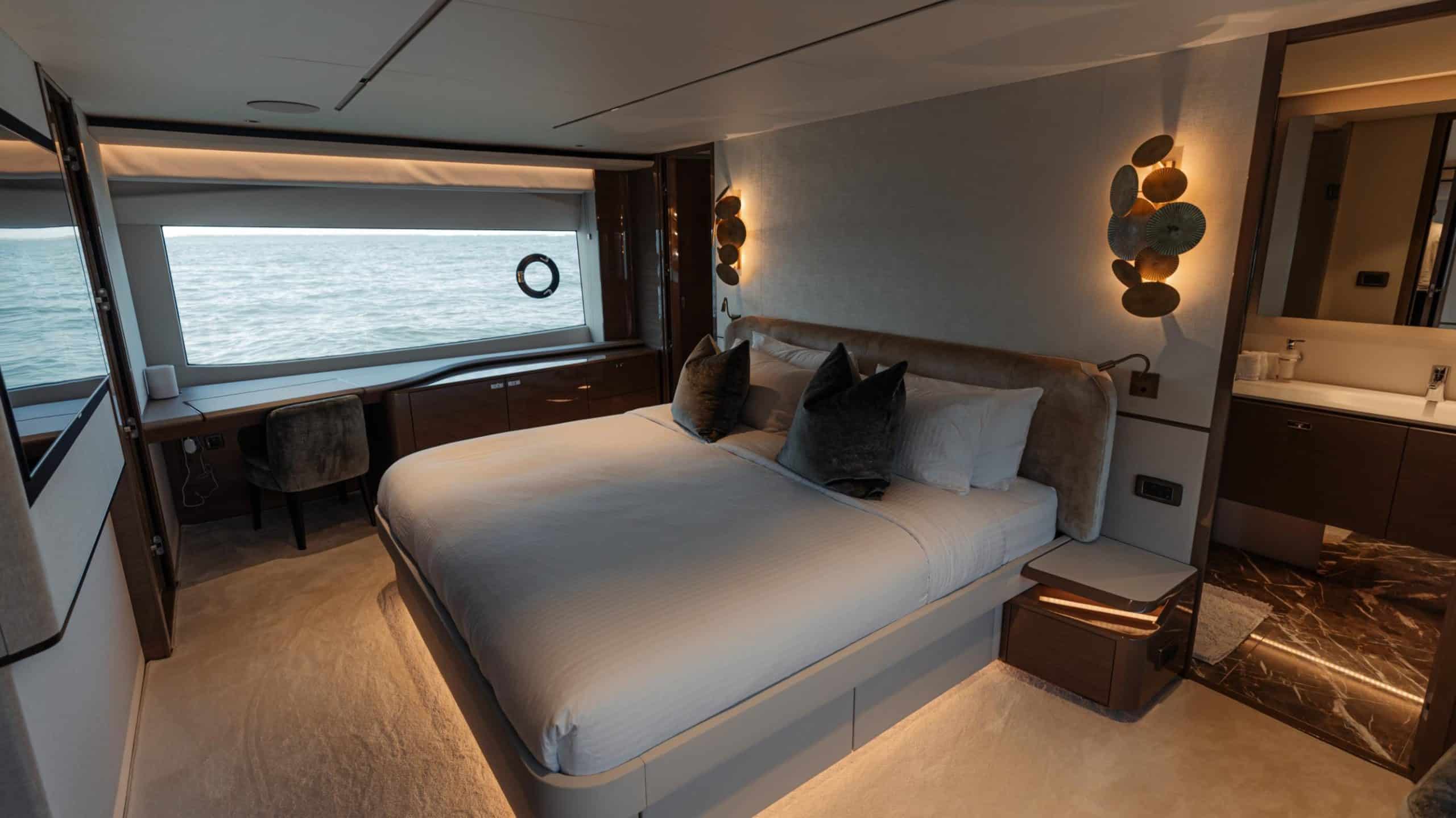 Princess X95 luxury yacht guest bedroom cabin with premium bedding and ambient lighting