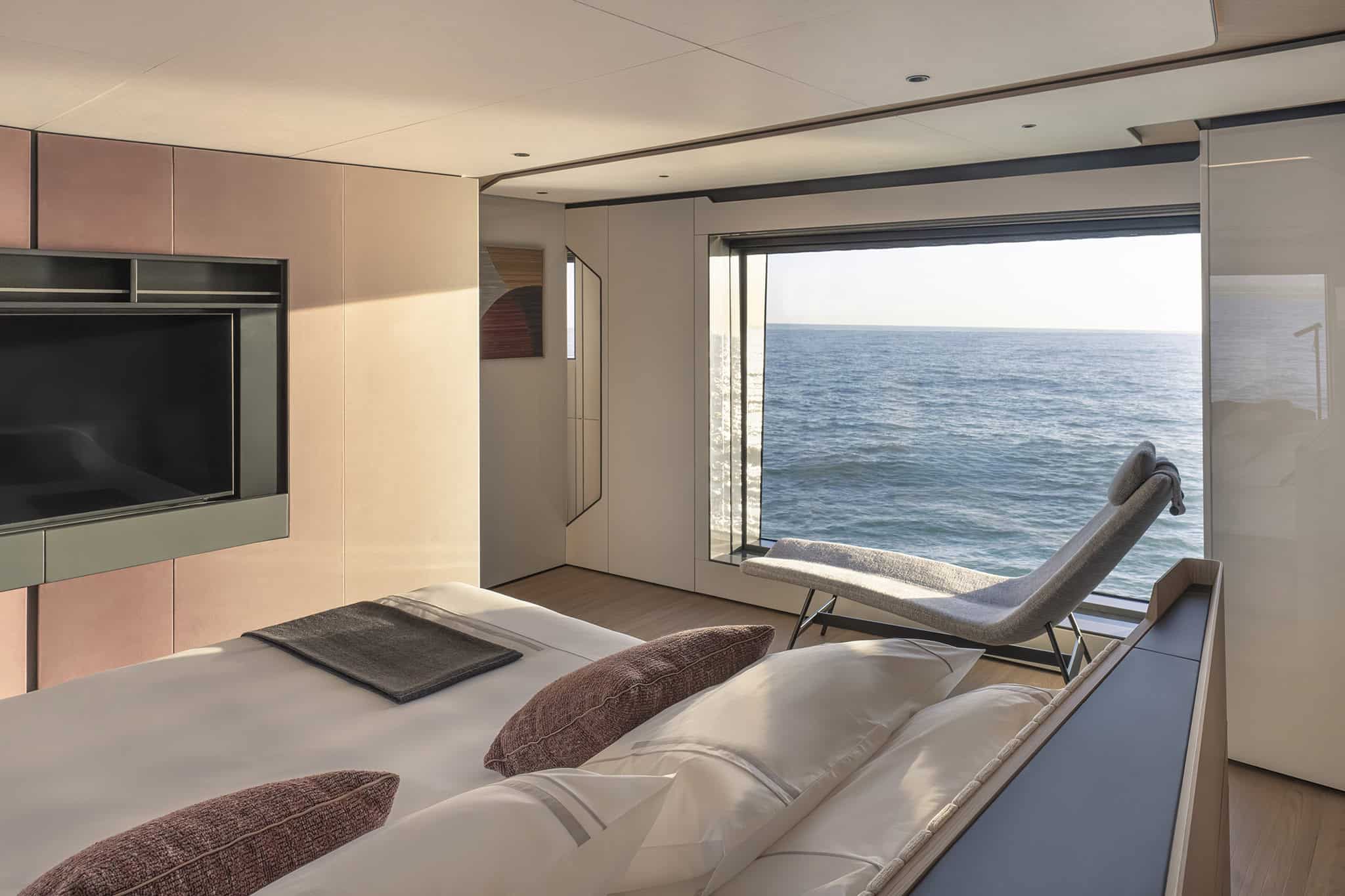 Azimut Grande 36M owner cabin with chaise longue by the panoramic window, shipyard photo