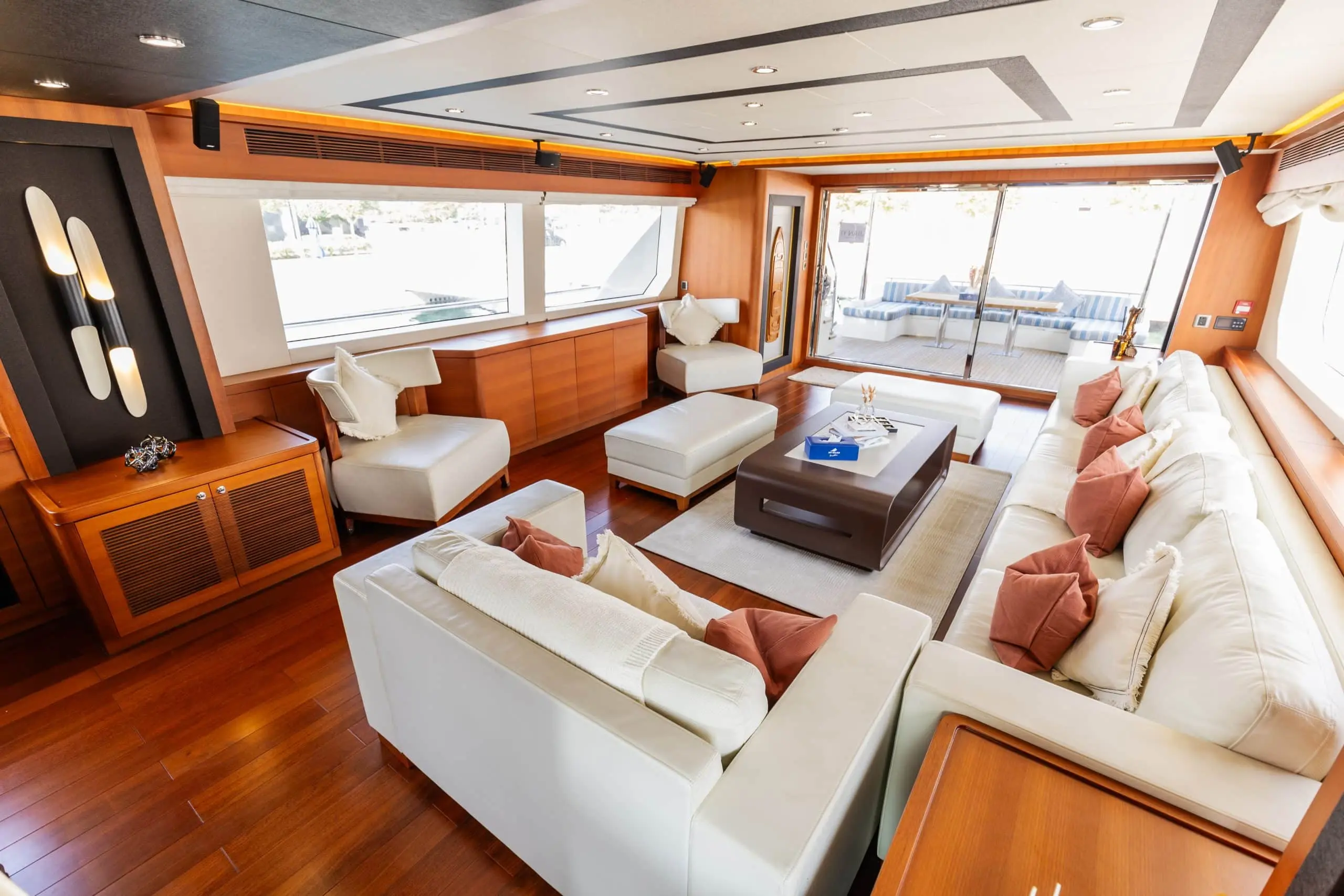 Cante 97 yacht seating area with cushions and wooden flooring