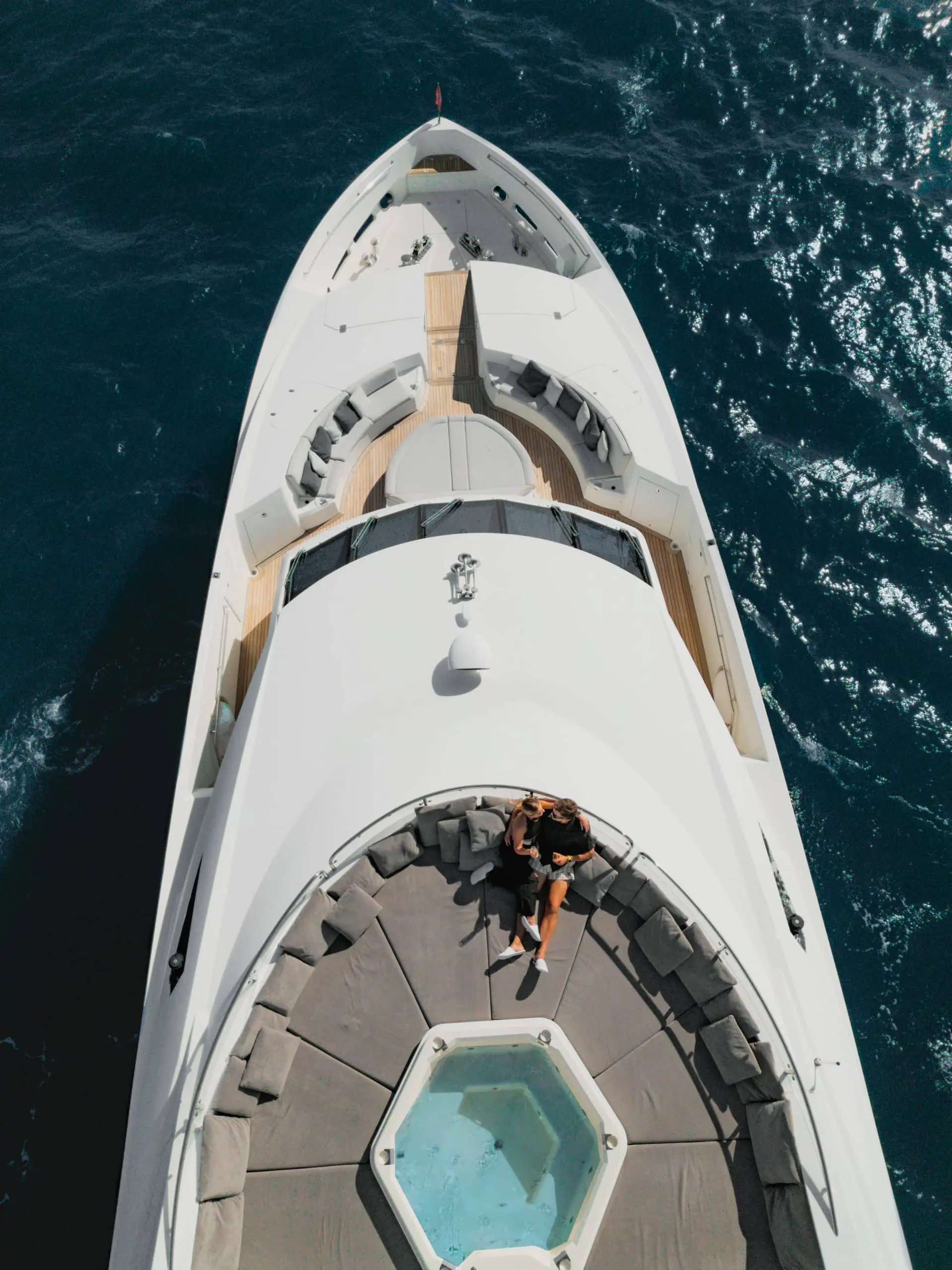 Aurora 130 yacht bow area from above with sun lounge seating