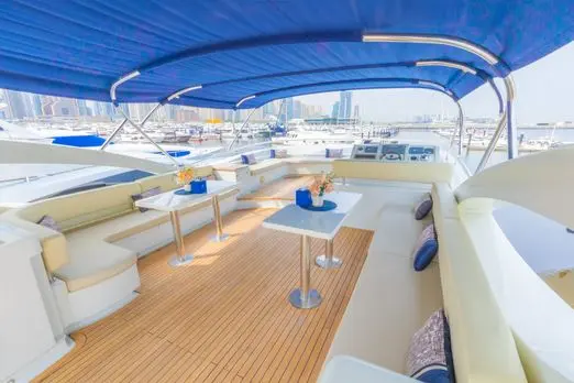 Asya 110 yacht flybridge seating area with blue canopy