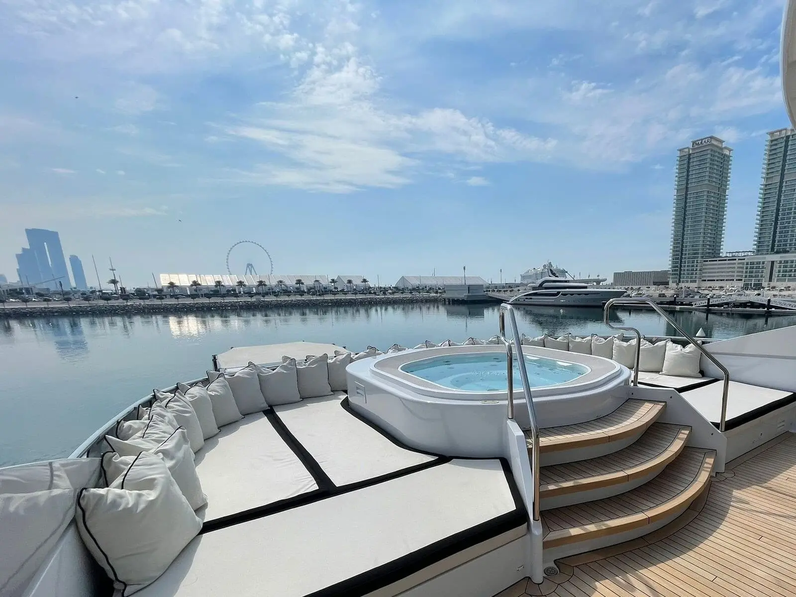 Heesen 5000 sundeck jacuzzi and sunpads overlooking the marina