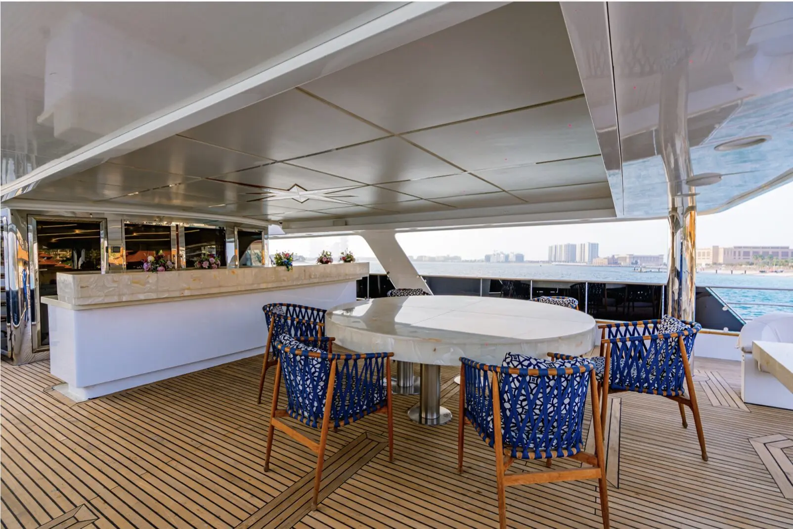 Luxury yacht dining area with round table on Finesse yacht Dubai