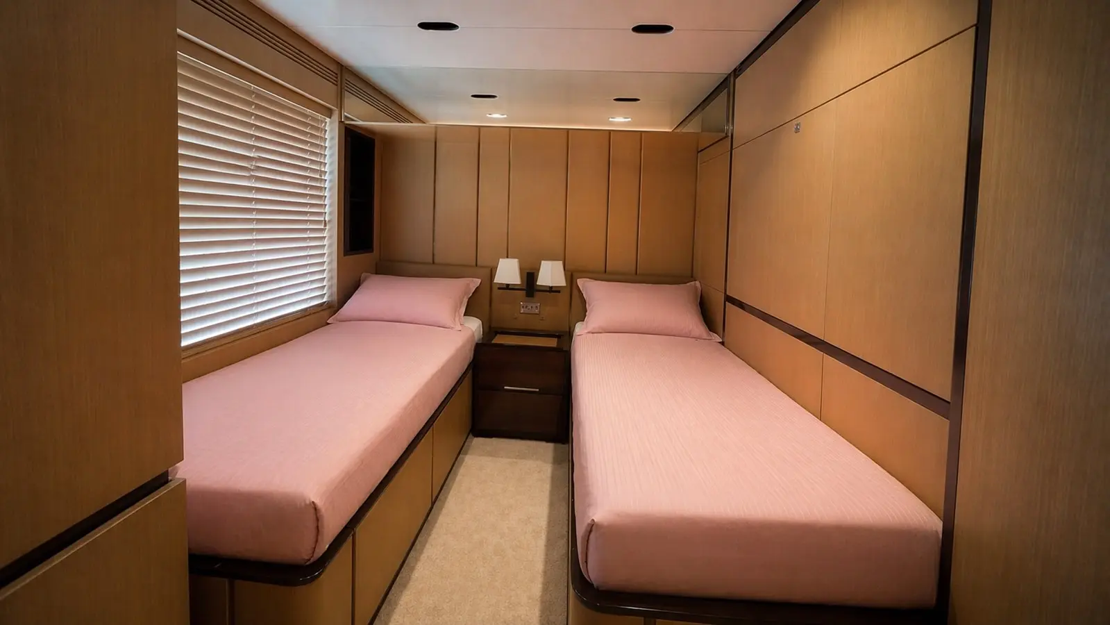 Azimut 88 twin guest cabin with two single berths in pink