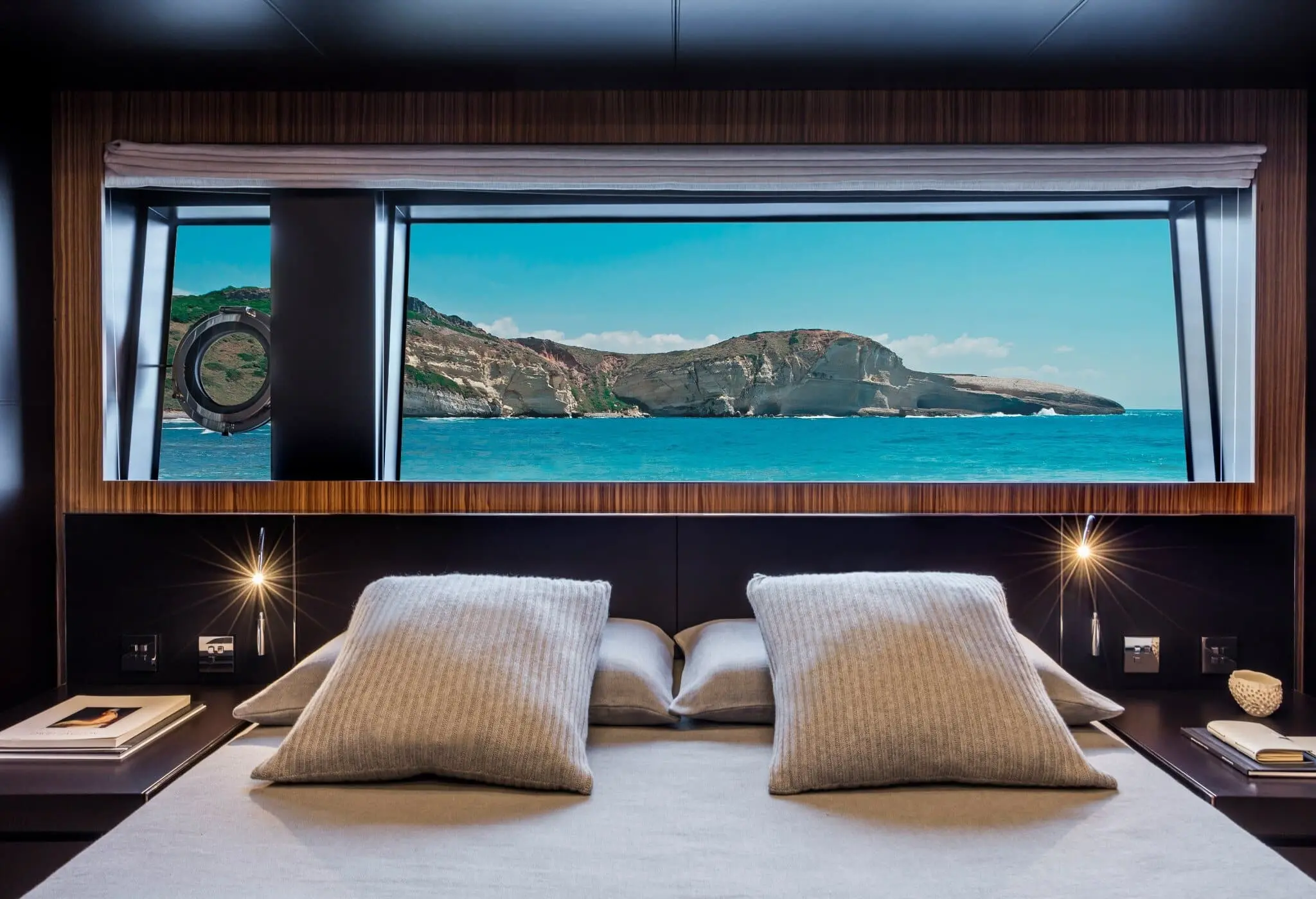 Riva 100 Corsaro guest cabin with panoramic hull-side window view