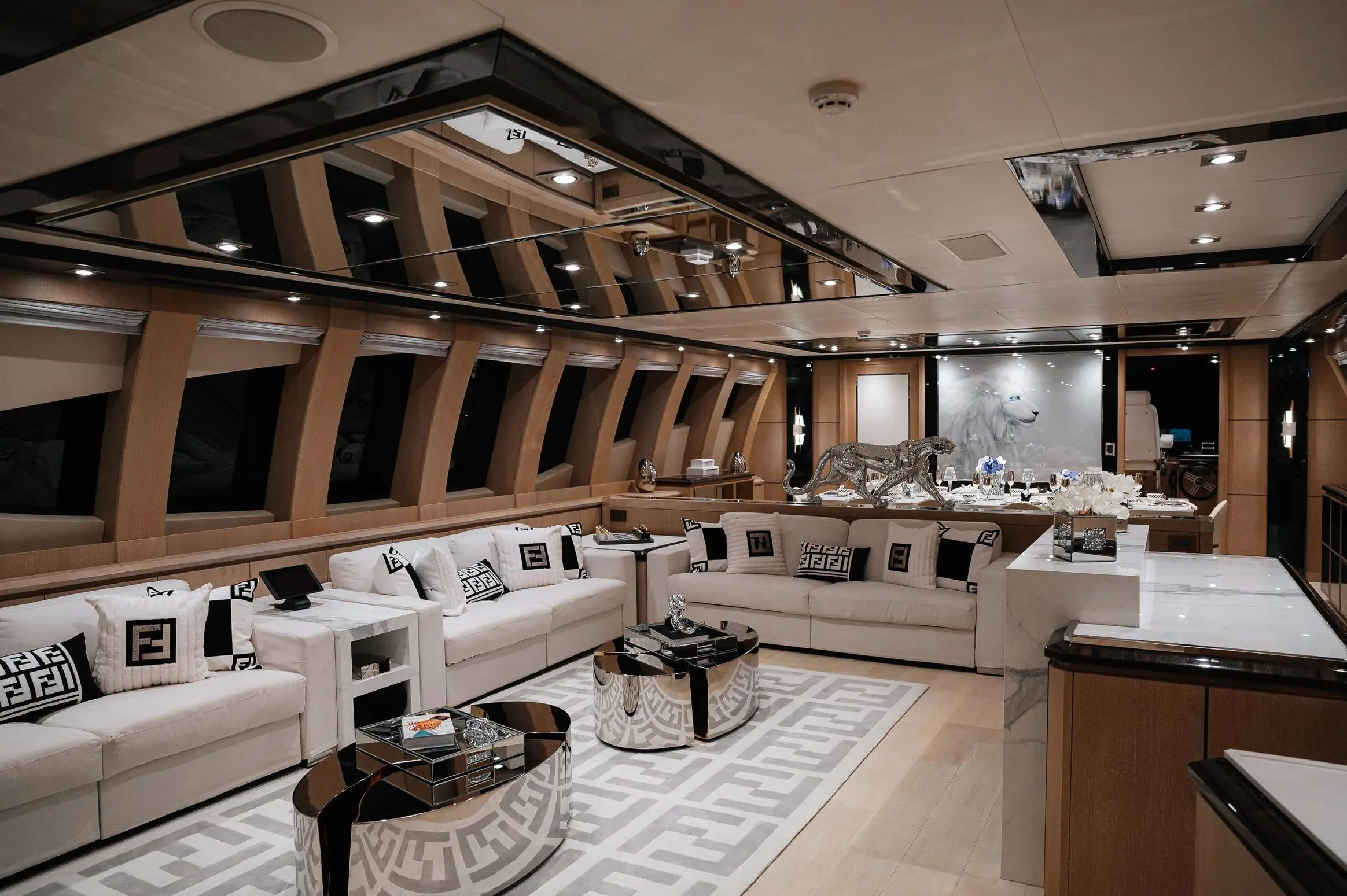 Royalty 136 yacht main salon with modern luxury seating and panoramic windows