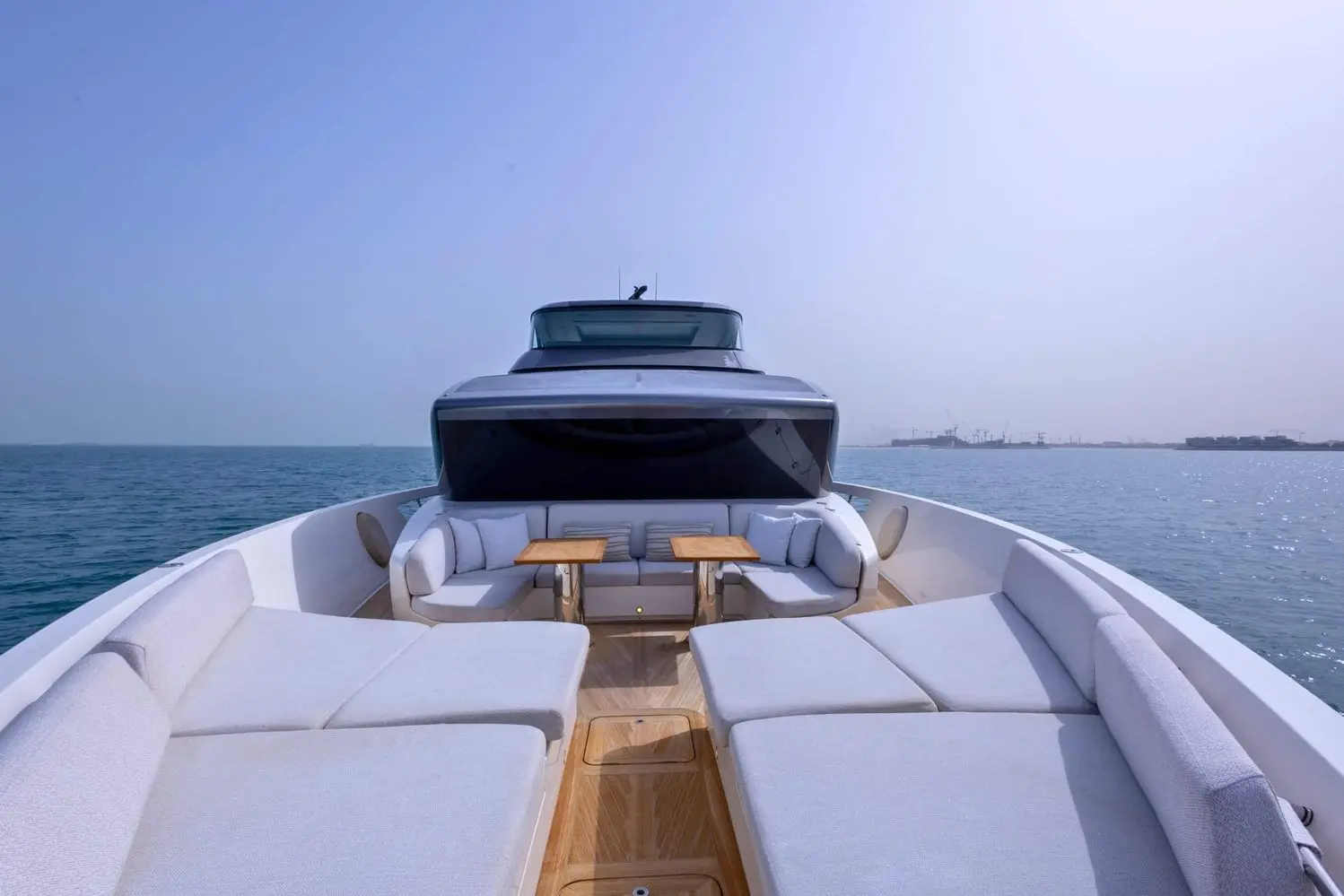 SanLorenzo SX88 bow lounge with teak tables and wraparound seating