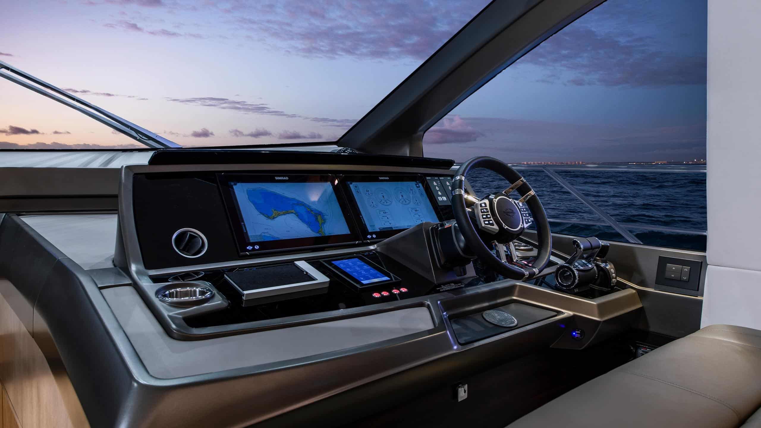 Sunseeker Manhattan 68 lower helm station at night — shipyard photo