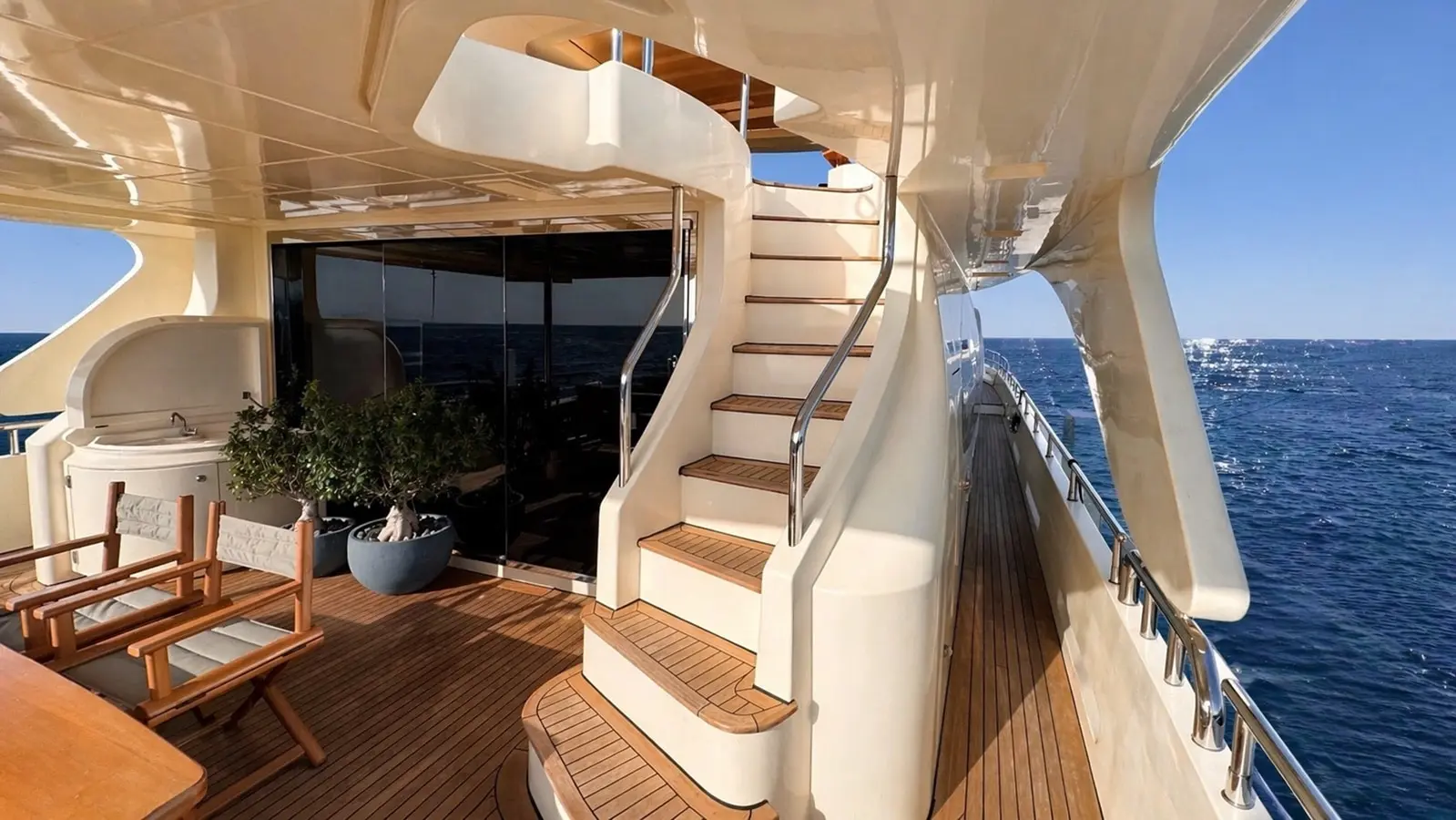 Azimut 88 cockpit with teak stairs leading to the flybridge
