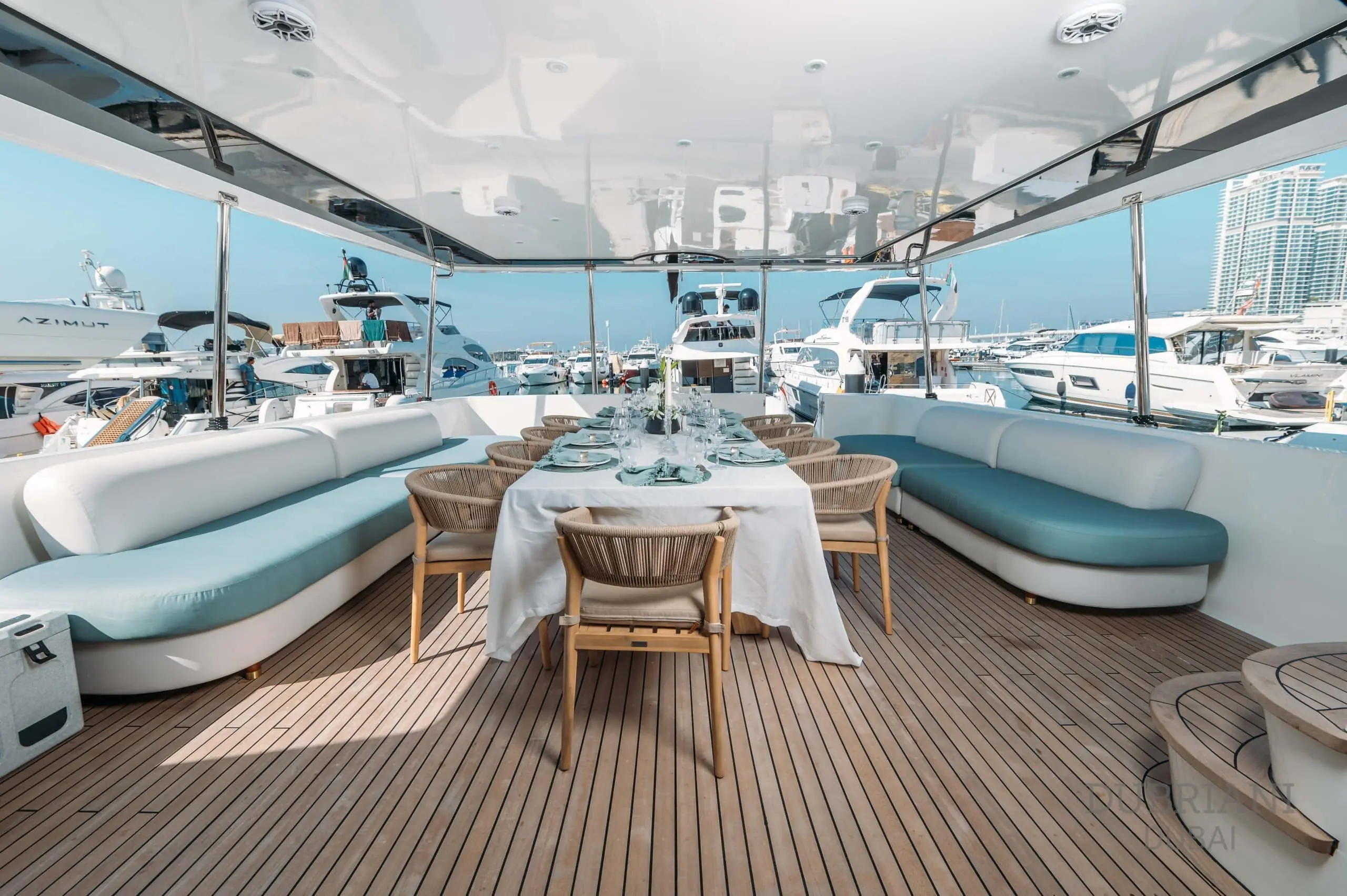 Luxury interior dining area on Eclipse yacht with elegant table setting and panoramic windows