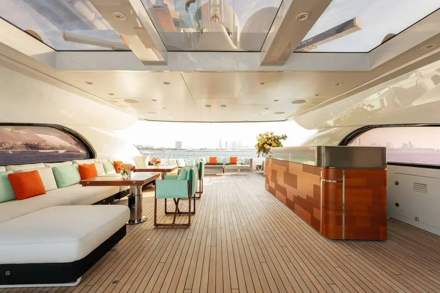 Heesen 5000 sundeck sky lounge with walk-up bar and teak sole