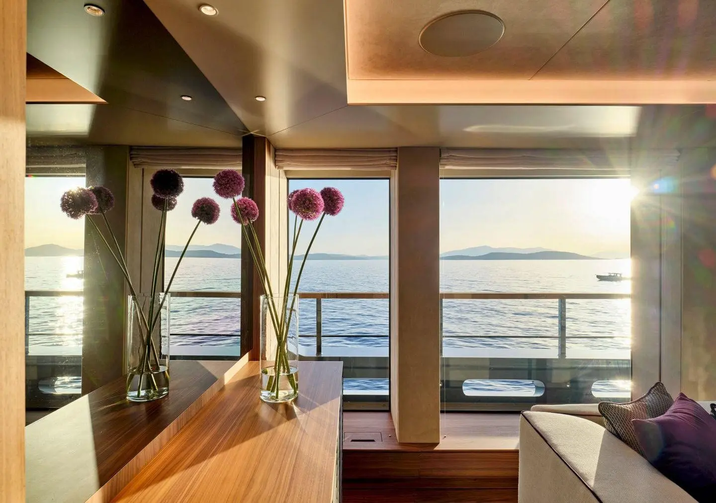 Sanlorenzo 500EXP salon window seat at sunset, broker photo