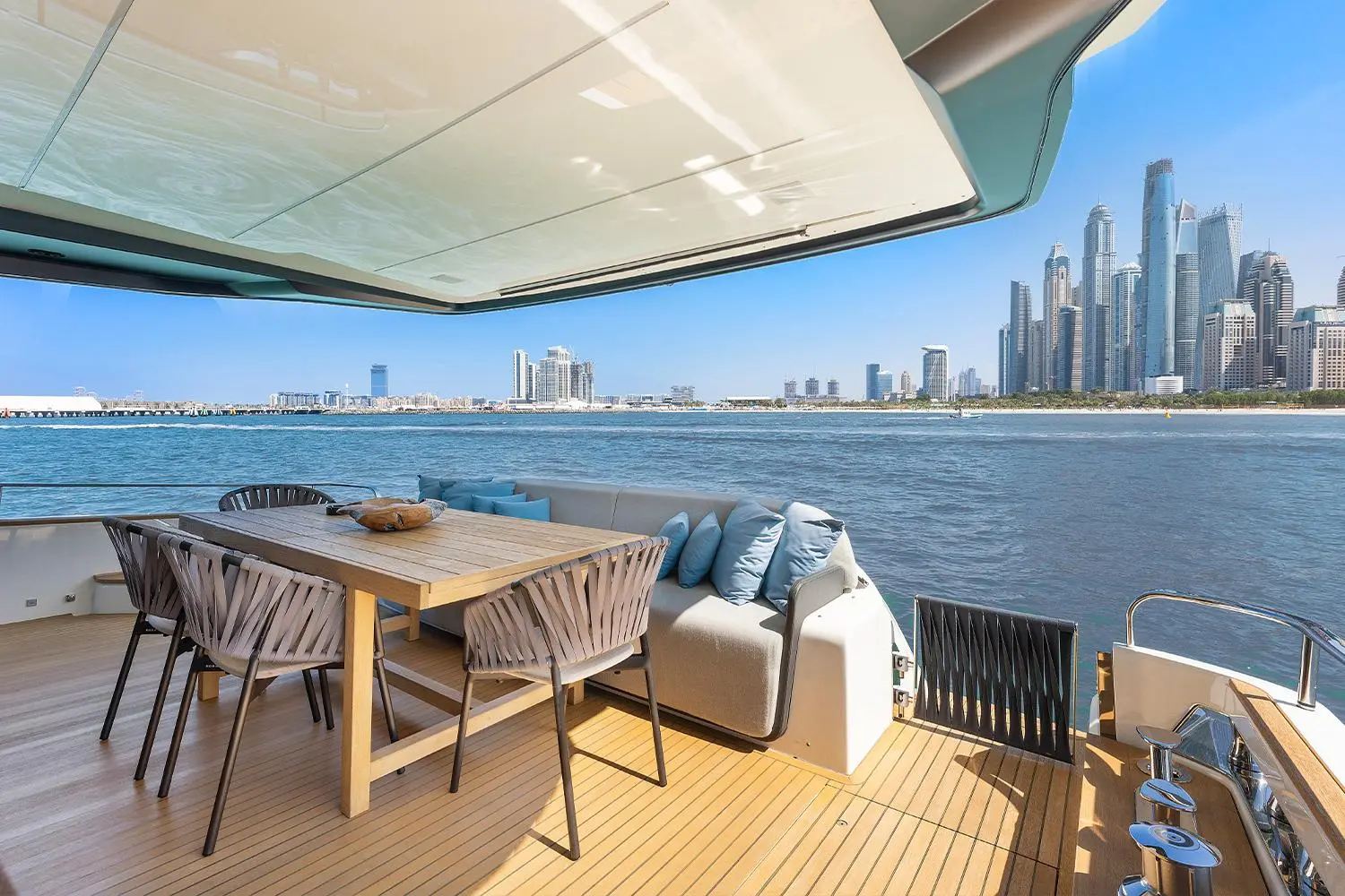Cranchi Settantotto 78 aft deck dining with Dubai Marina skyline view