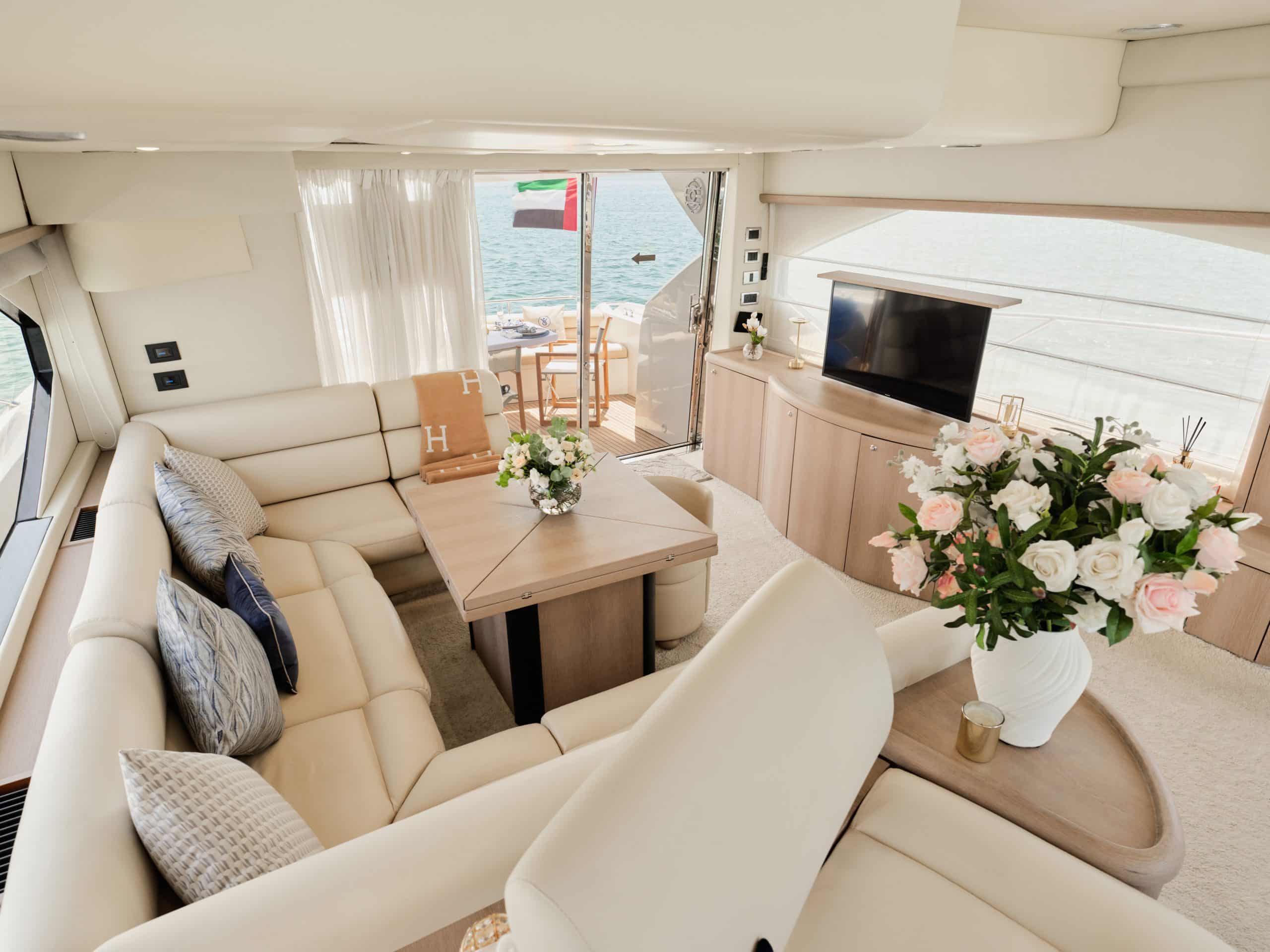 Sunseeker Satoshi 70 main salon with cream leather sofas and modern décor