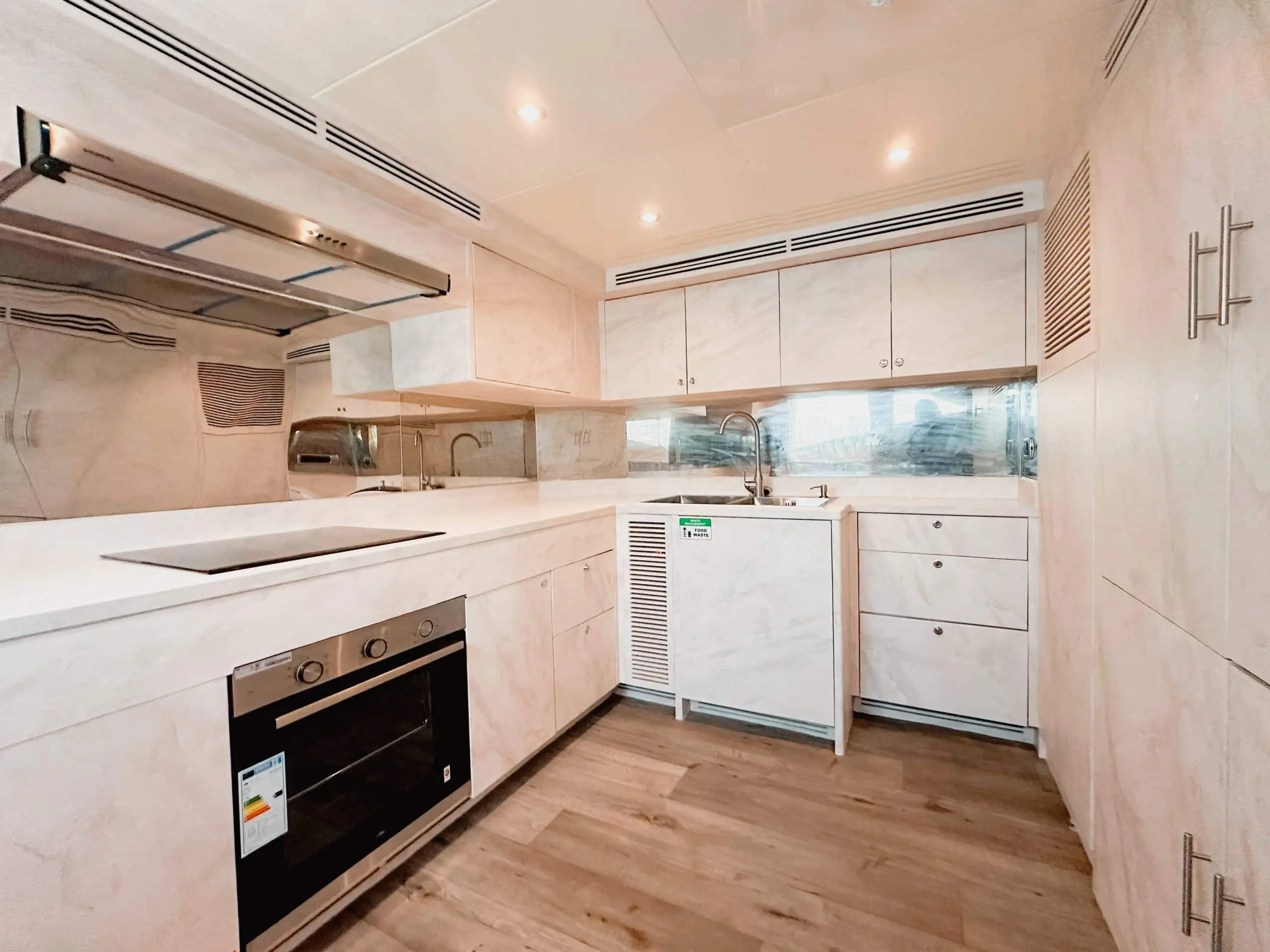 Modern galley kitchen onboard Luna 101 yacht at Yas Marina Abu Dhabi
