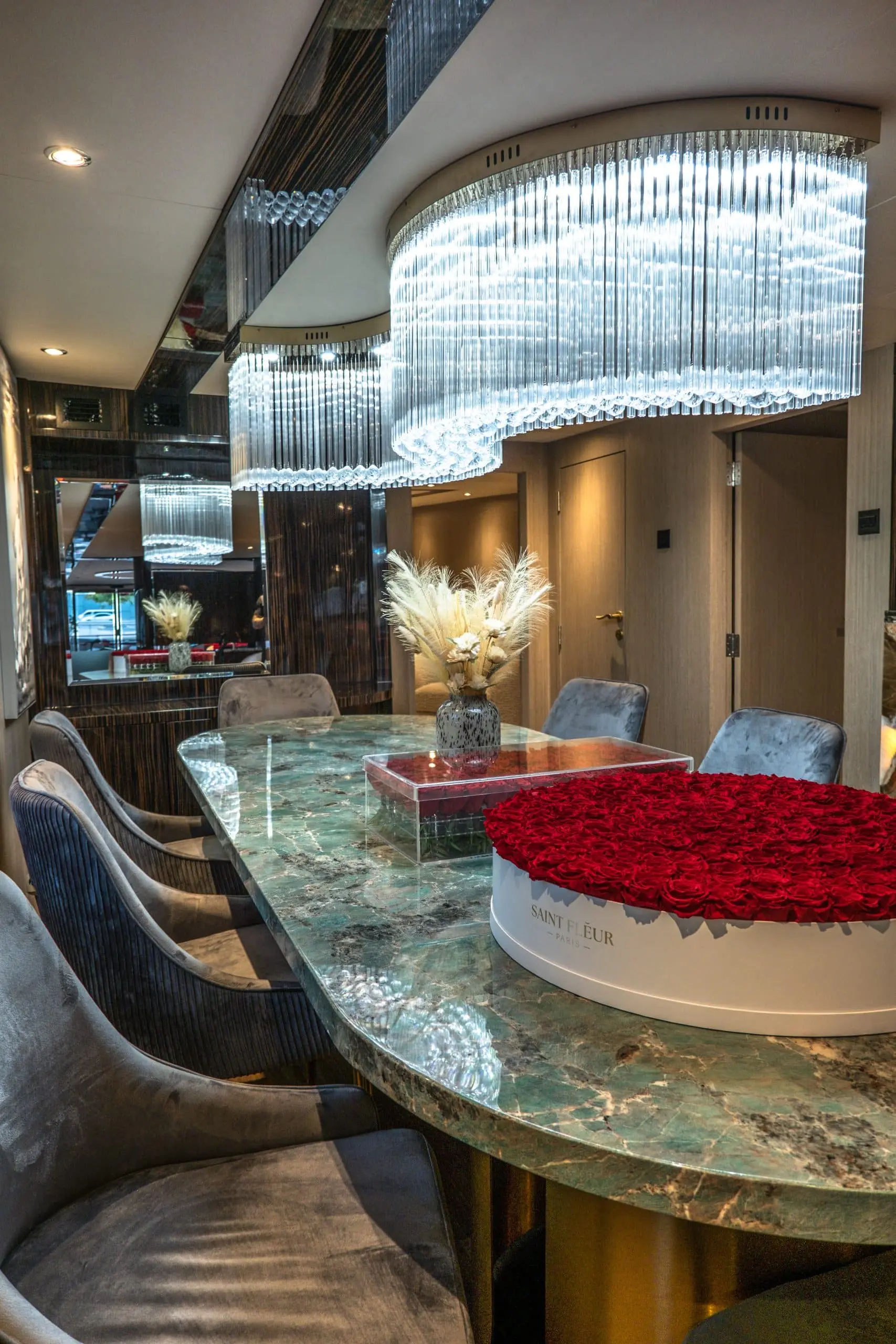 Elegant dining area with chandelier on Sapphire 150 Yacht