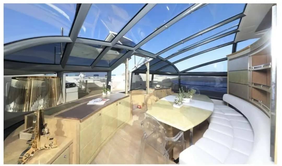 Baia 100 saloon bar with designer lamp beneath glass roof
