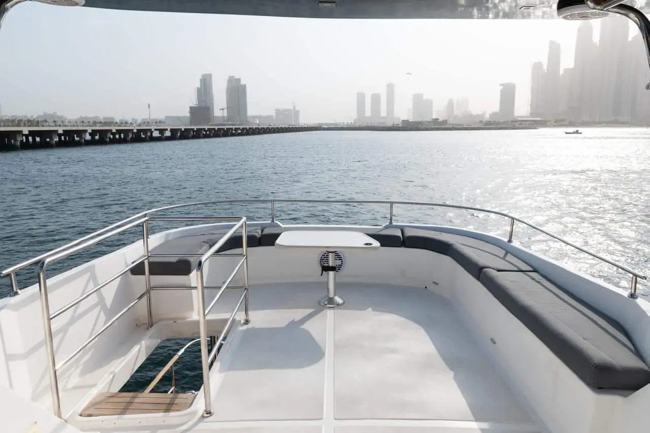 Bow view of Zenith 64 yacht with Dubai skyline ahead