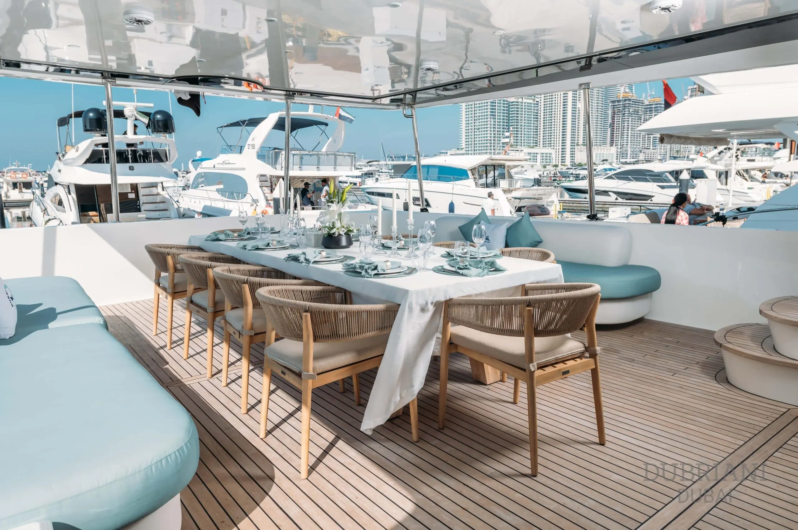 Luxury interior dining area on Eclipse yacht with elegant table setting and panoramic windows