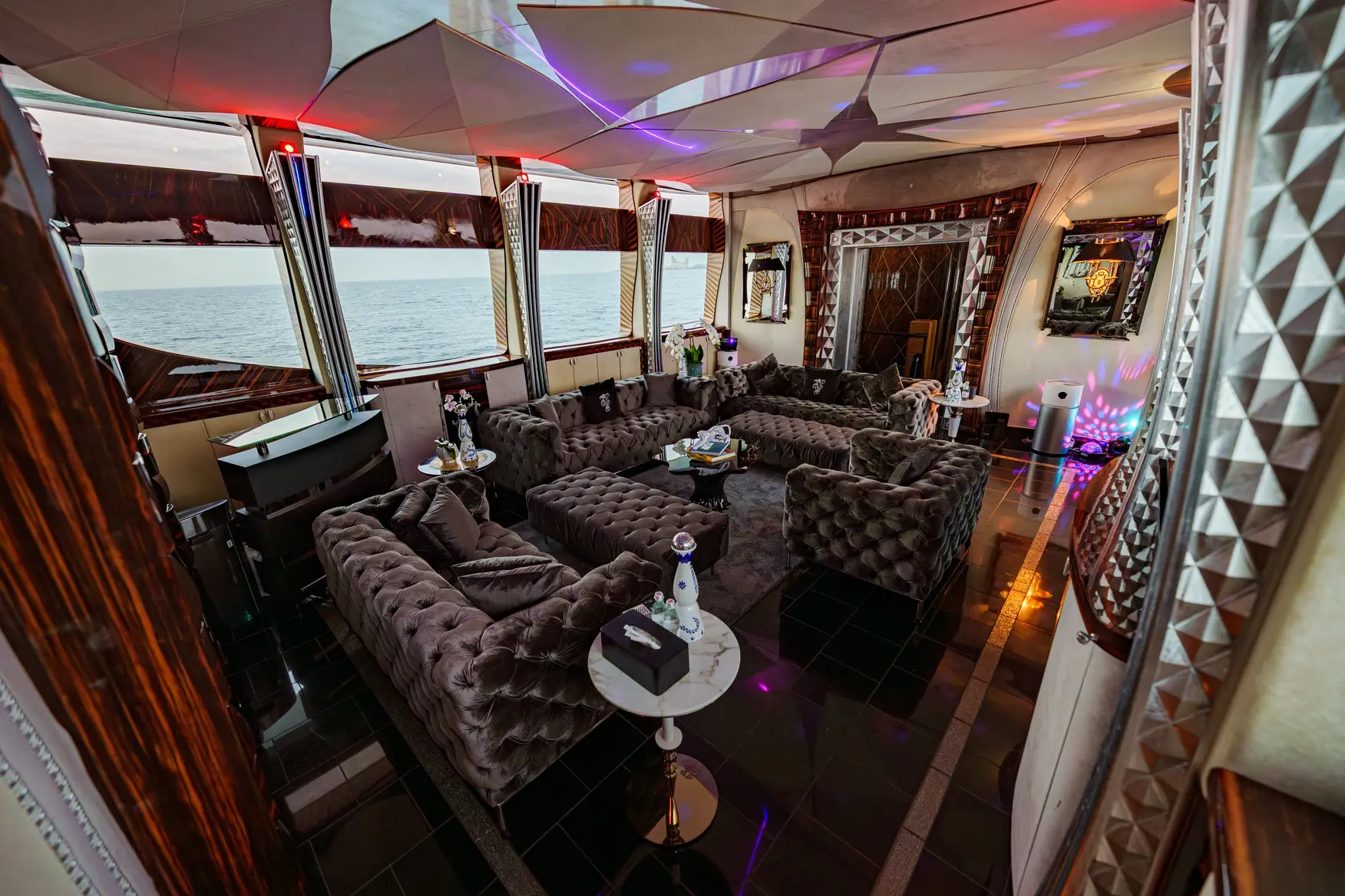 Thunder Superyacht lounge setup with evening lighting and event ambiance