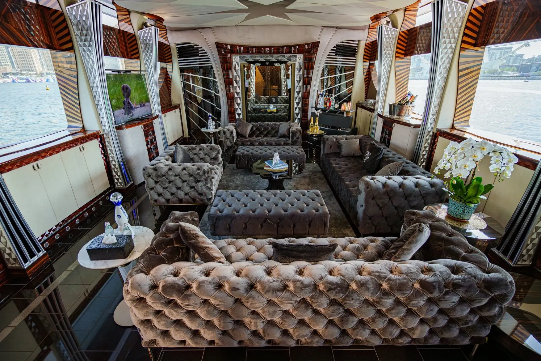 Thunder Superyacht seating area with plush sofas and panoramic windows