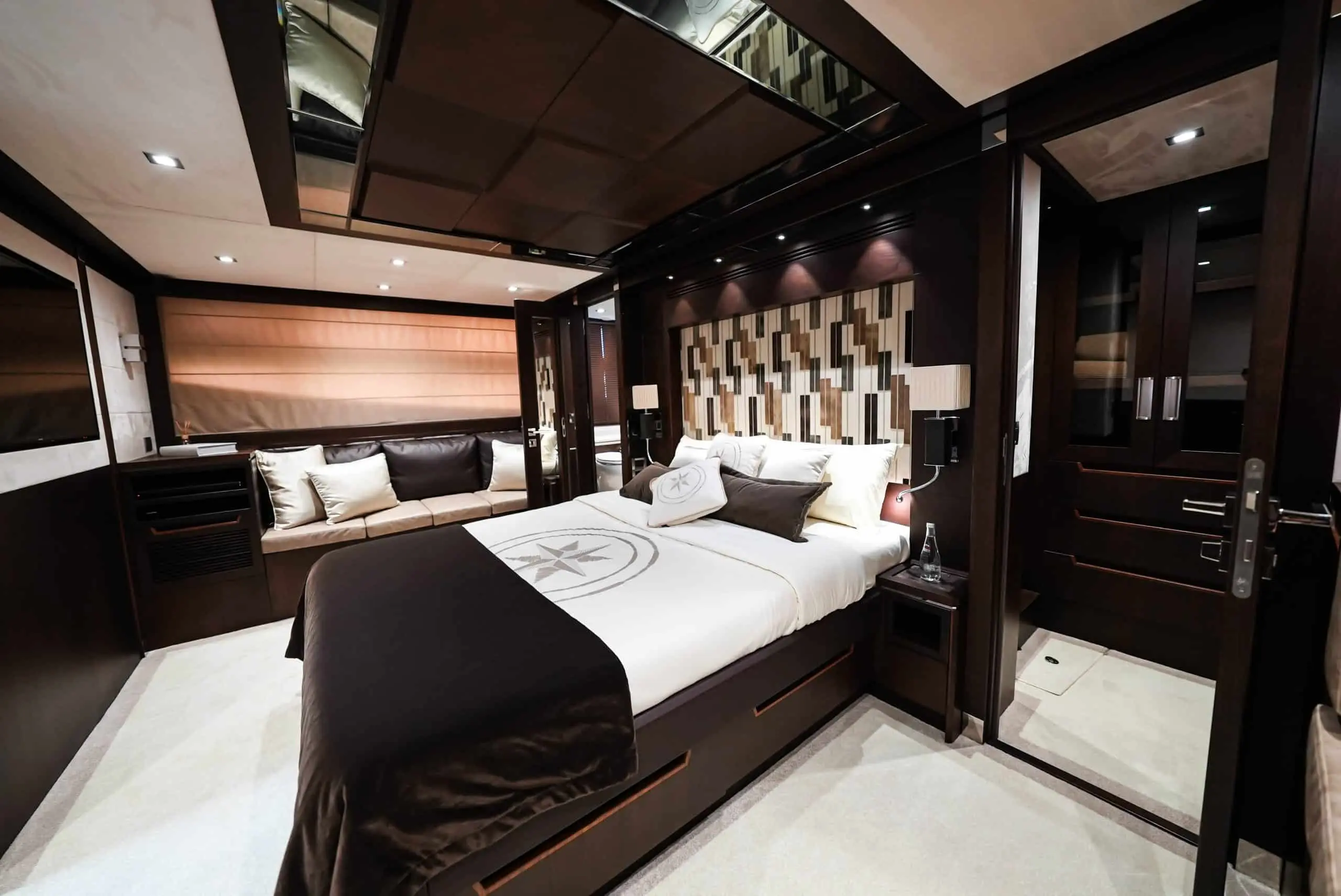 Galeon 780 F1 VIP cabin with luxury bed, padded headboard, and glossy wood finishes