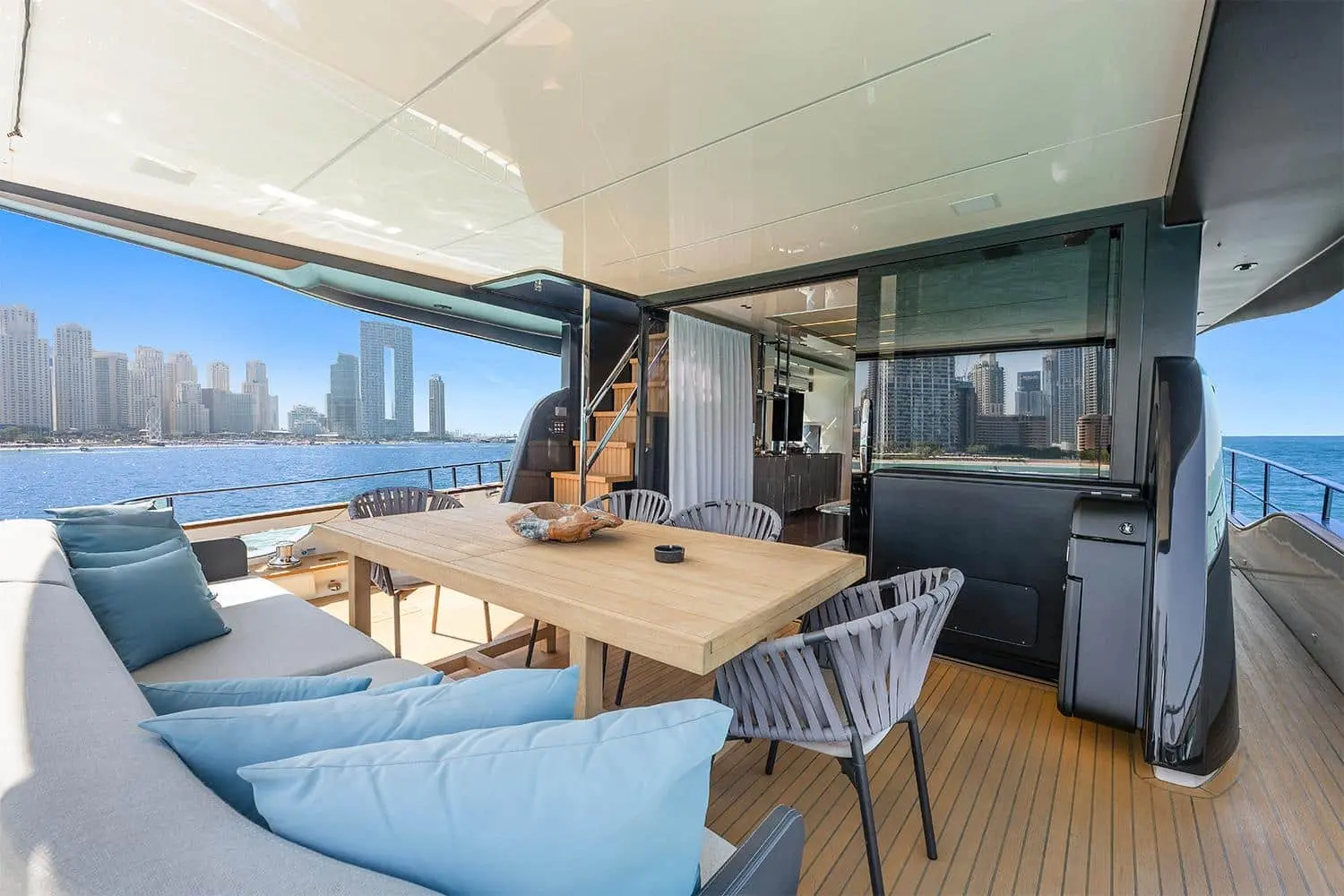 Cranchi Settantotto 78 covered aft deck dining beside the saloon