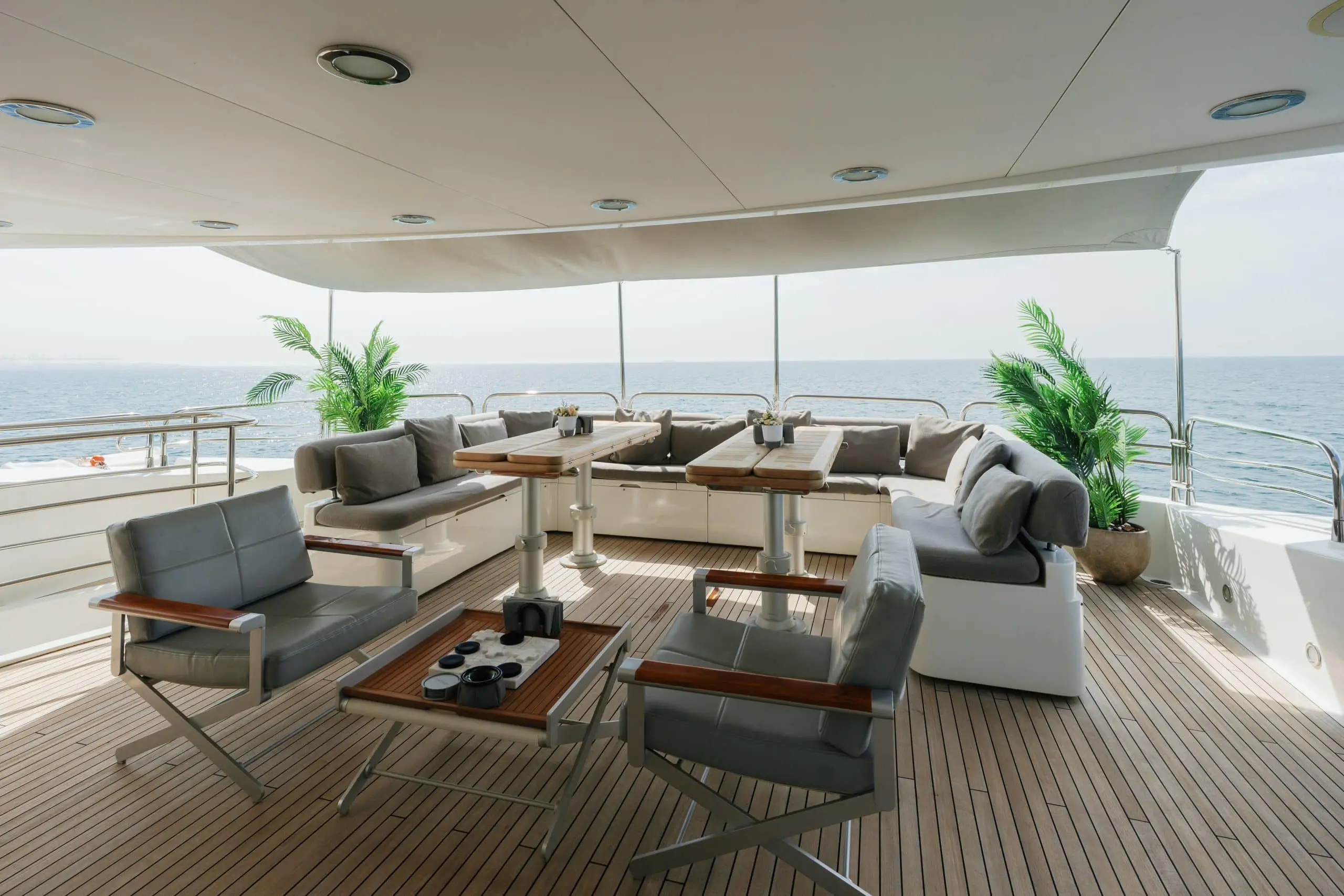 Aurora 130 yacht interior lounge with wraparound seating and ocean views