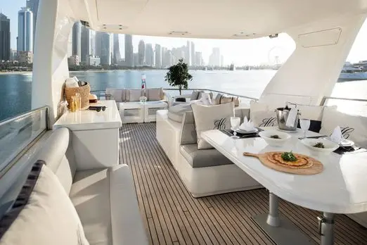 Luxury yacht spacious deck seating area overlooking Dubai Marina
