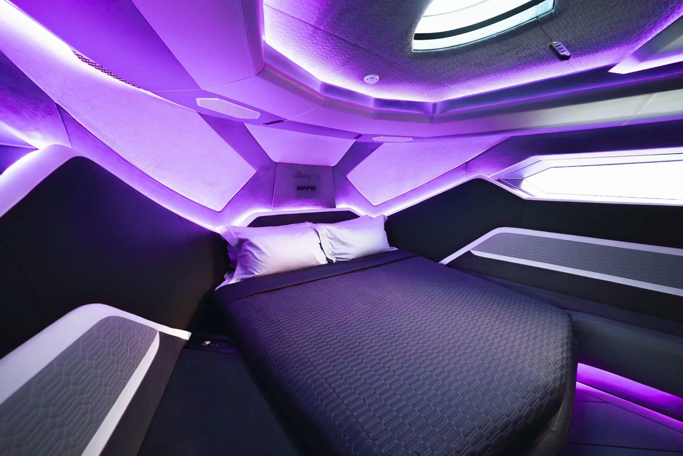Lamborghini 63 yacht interior cabin with purple ambient LED lighting and modern angular design