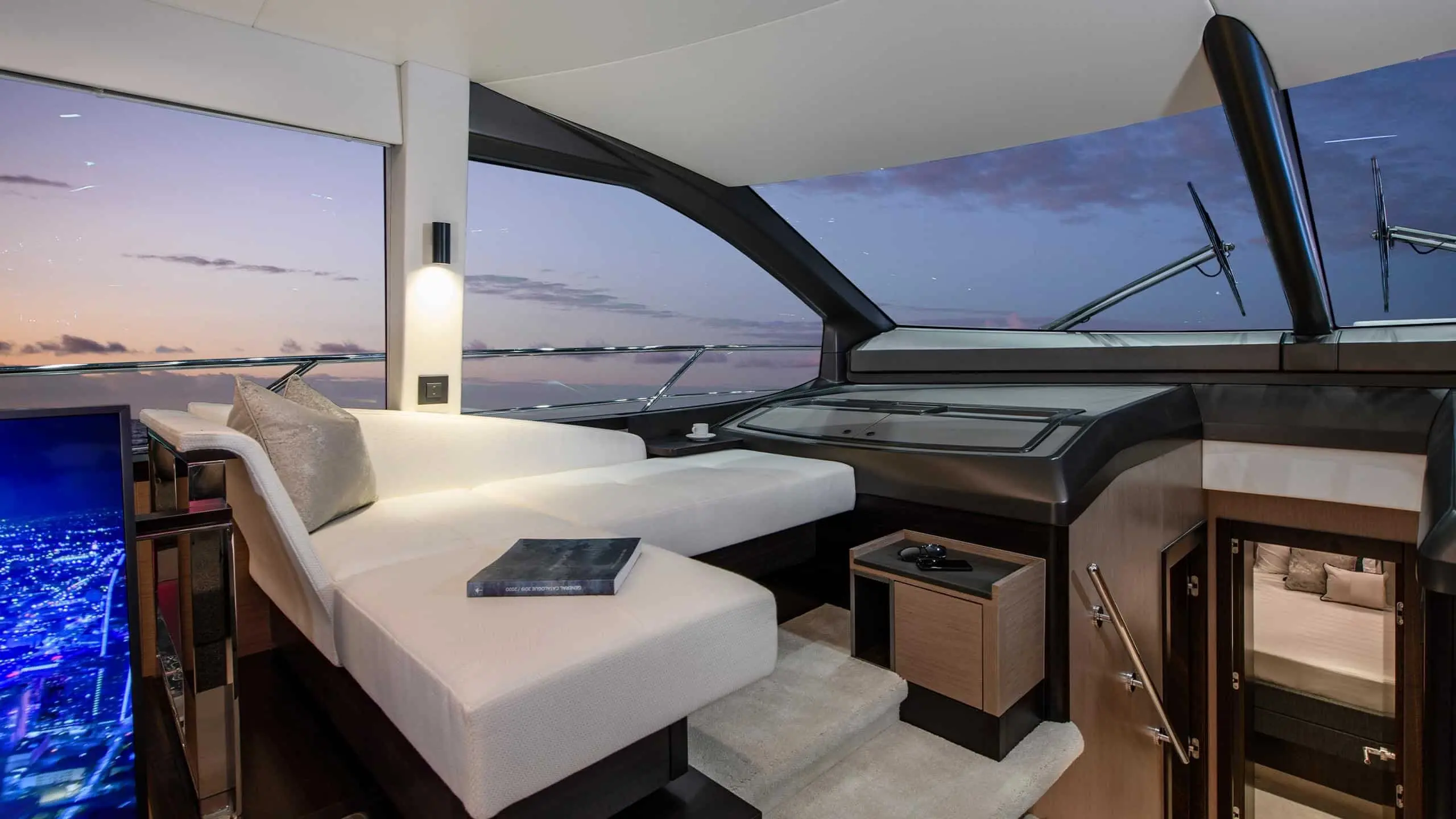 Sunseeker Manhattan 68 galley and dinette at dusk — shipyard photo