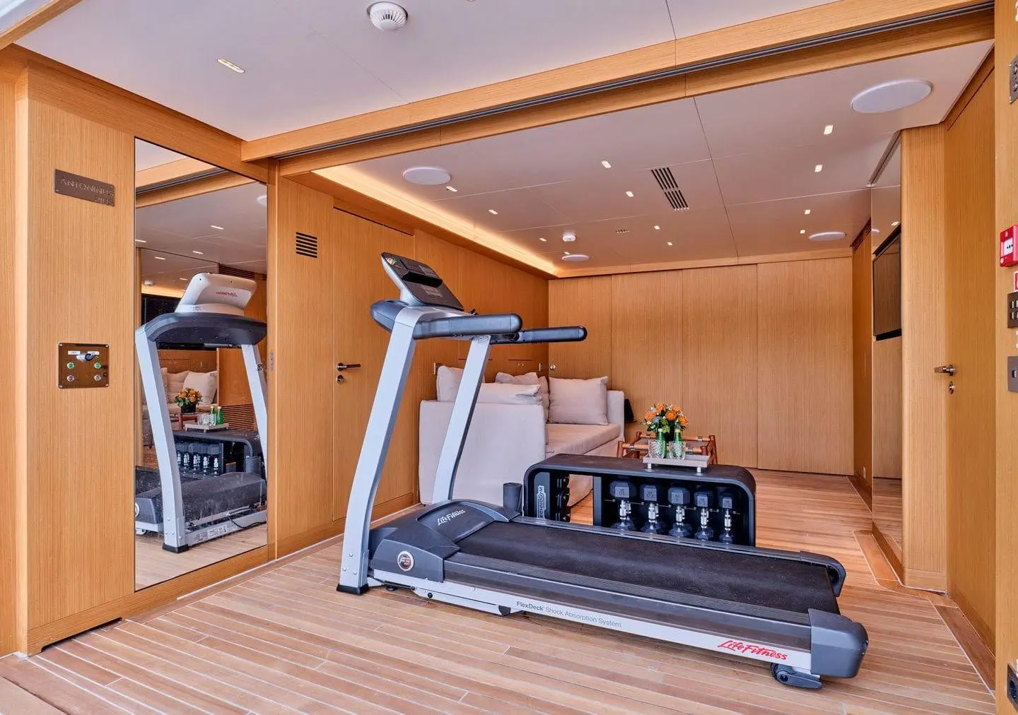 Sanlorenzo 500EXP gym with treadmill and weights, broker photo