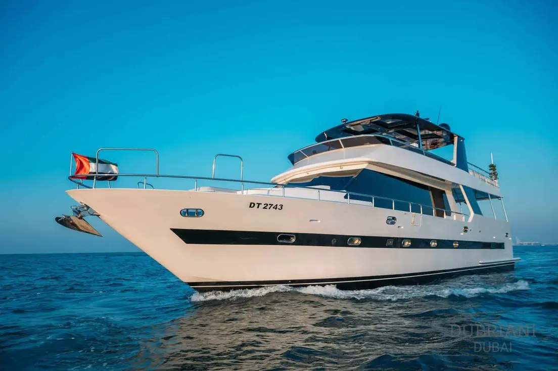 Side profile of Eclipse luxury yacht cruising on calm blue waters
