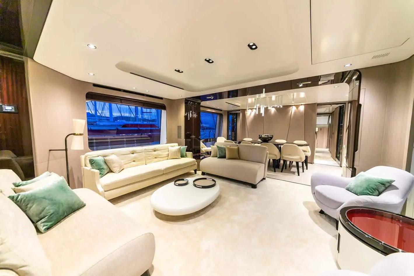 Azimut Grande 27M main salon lounge at dusk, broker photo