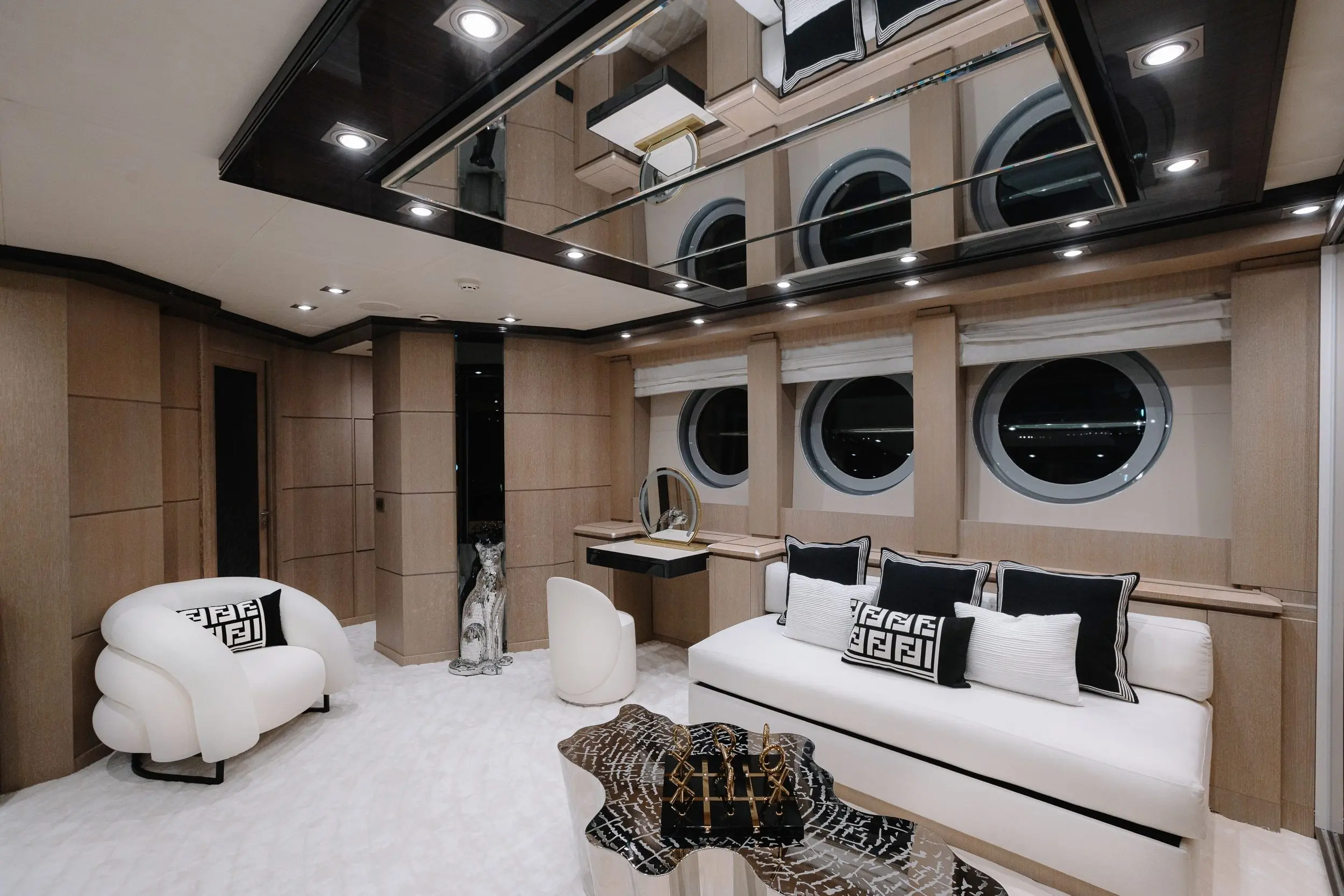 Royalty 136 yacht upper deck lounge with large windows and contemporary seating