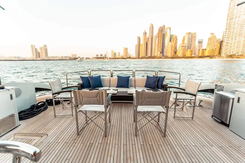 Baglietto 105 HT aft deck dining facing the JBR skyline