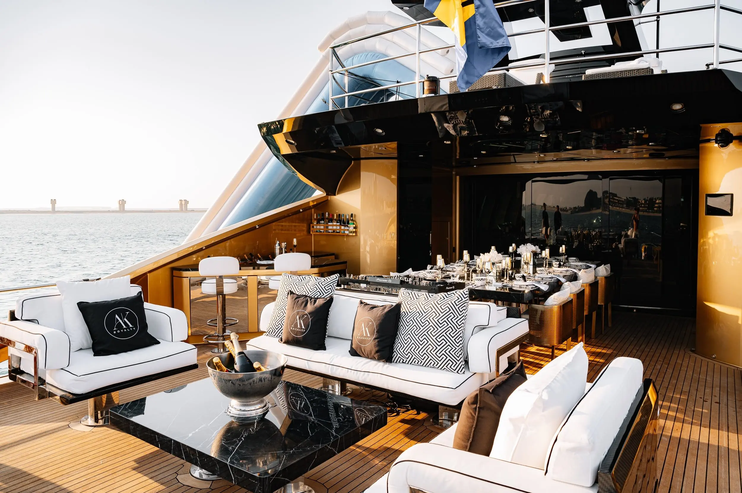 Outdoor lounge seating area on Royalty 136 luxury yacht