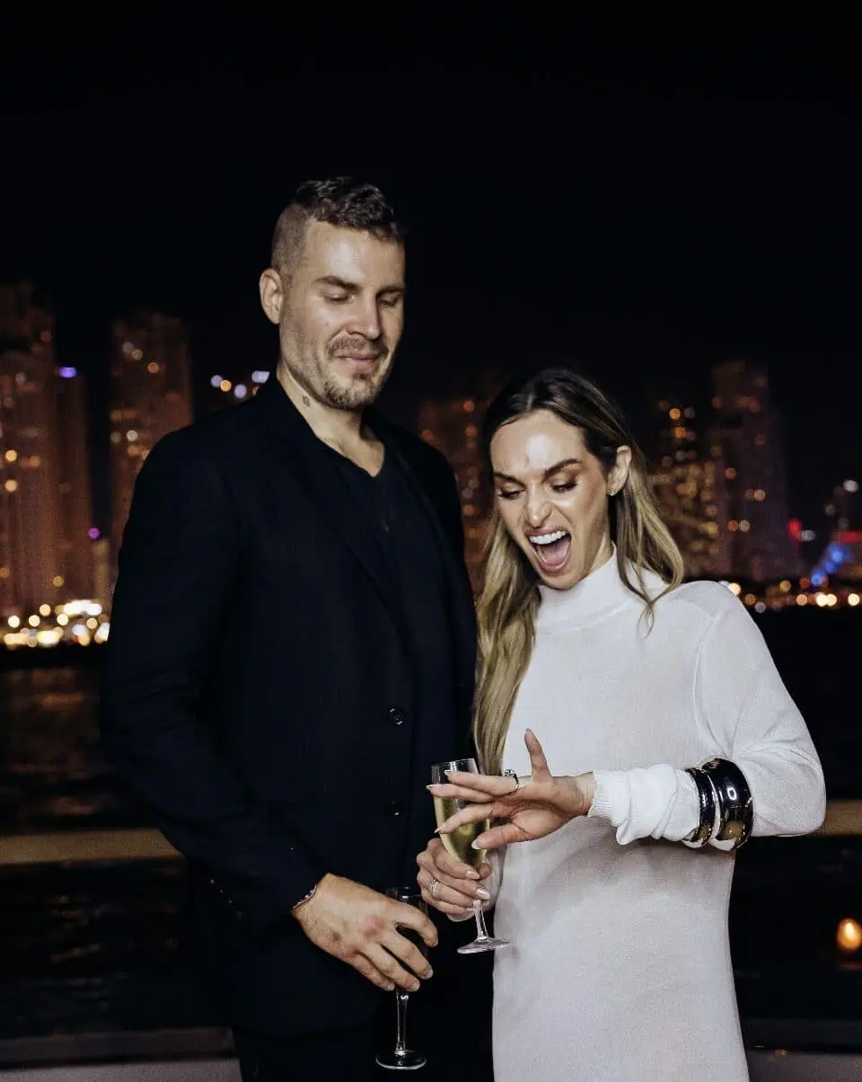 Couple celebrating engagement on luxury yacht in Dubai at night
