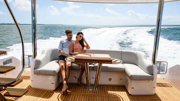 Sunseeker Manhattan 68 cockpit dining underway at sea — shipyard photo