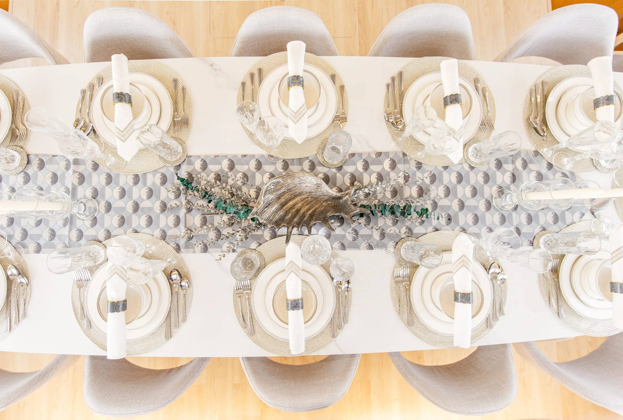 Zirve 72 yacht elegant dining table setup with luxury plates and decorative arrangement