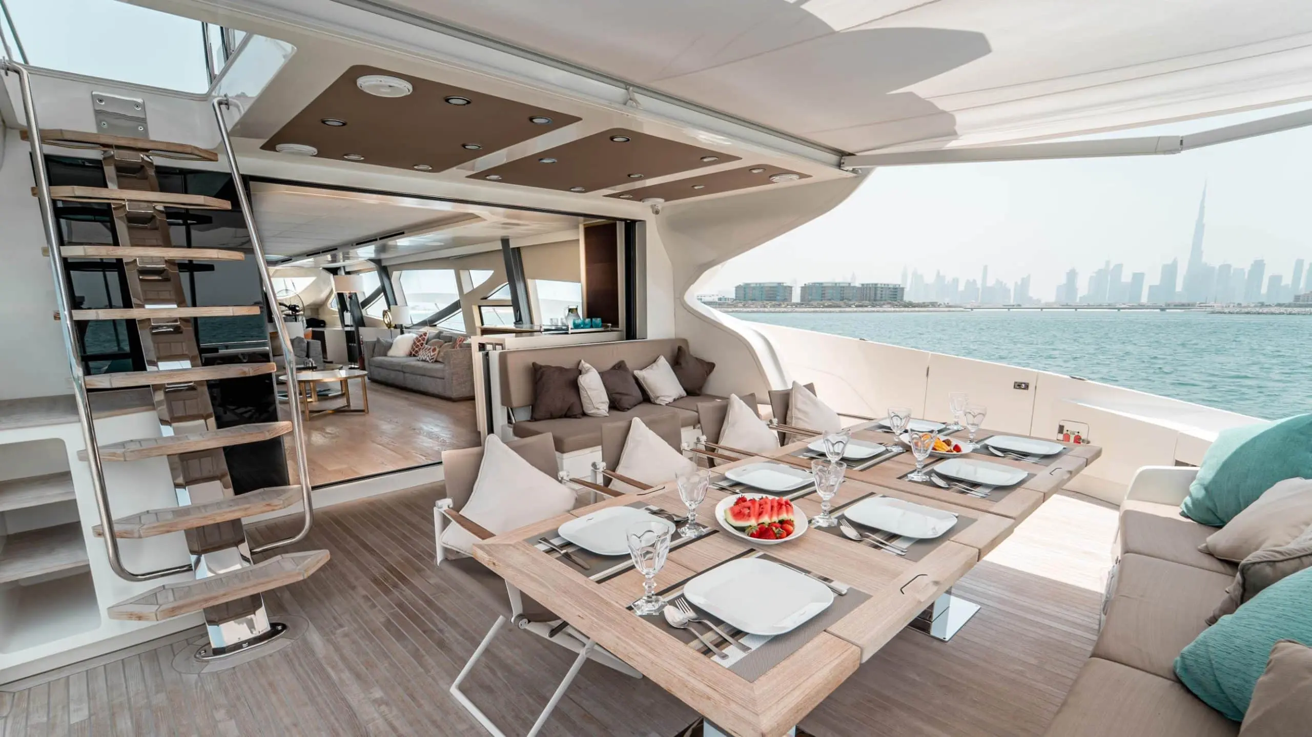 Shaded outdoor dining area on Dolce Vita yacht under canopy